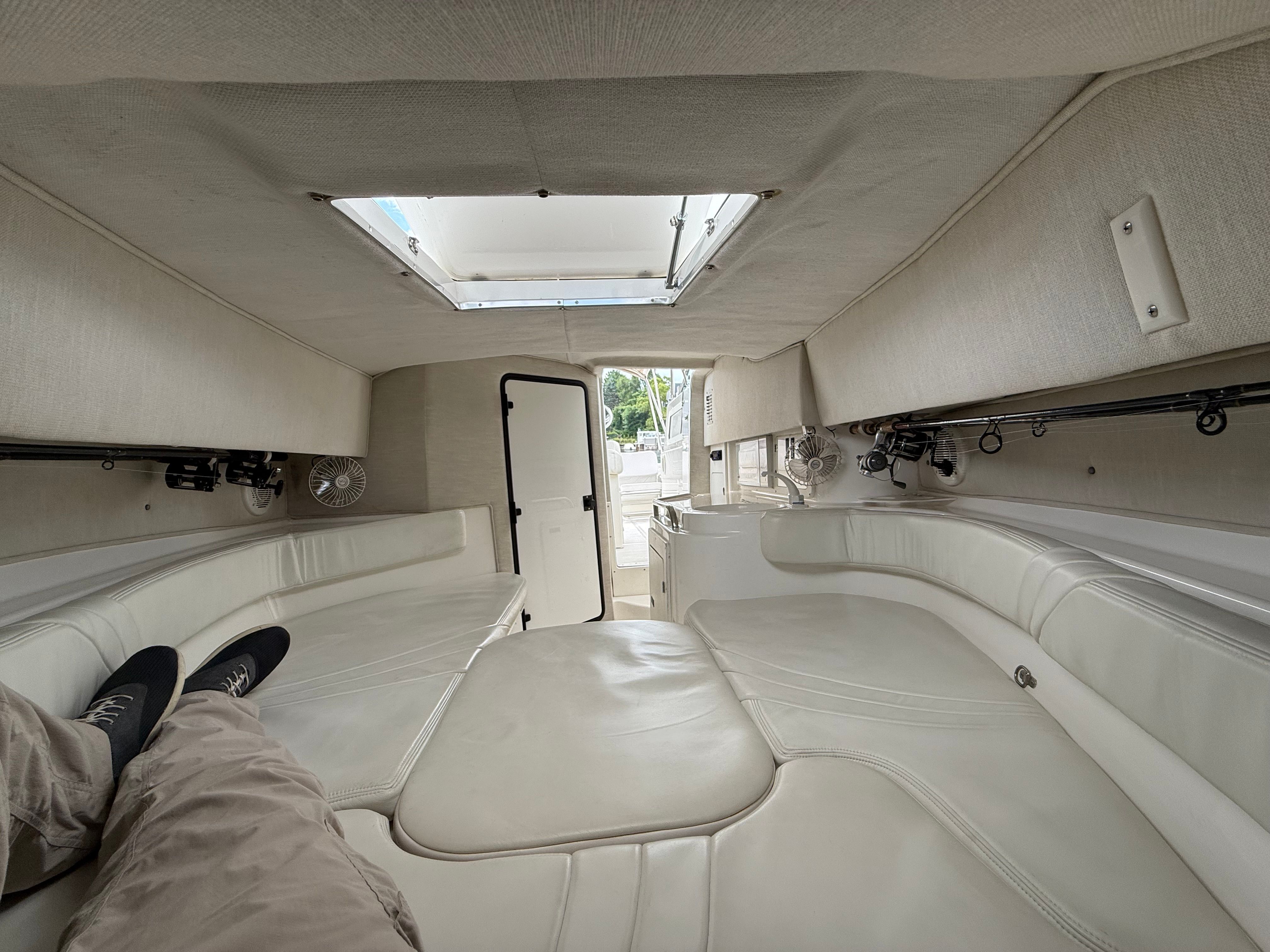 Interior of 1999 Fountain 32 Sport Fish Cruiser with comfortable seating.