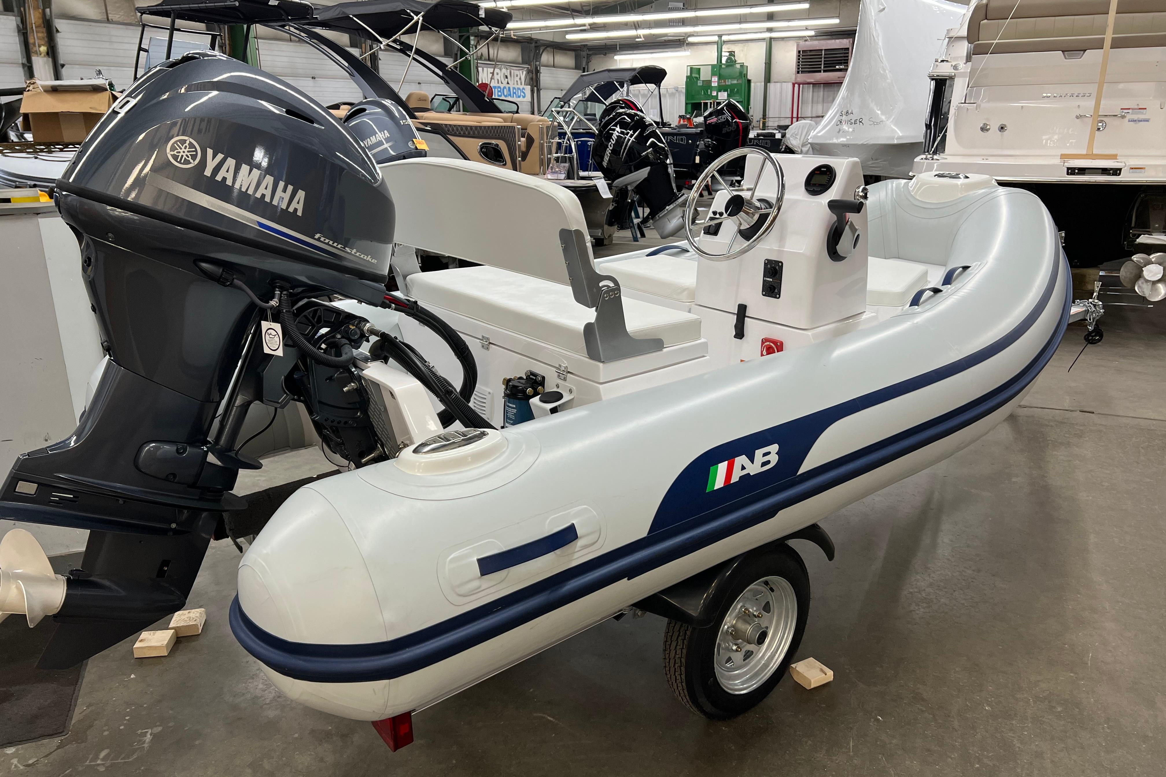 2023 AB Inflatables Mares 11 VSX boat with Yamaha engine in showroom.