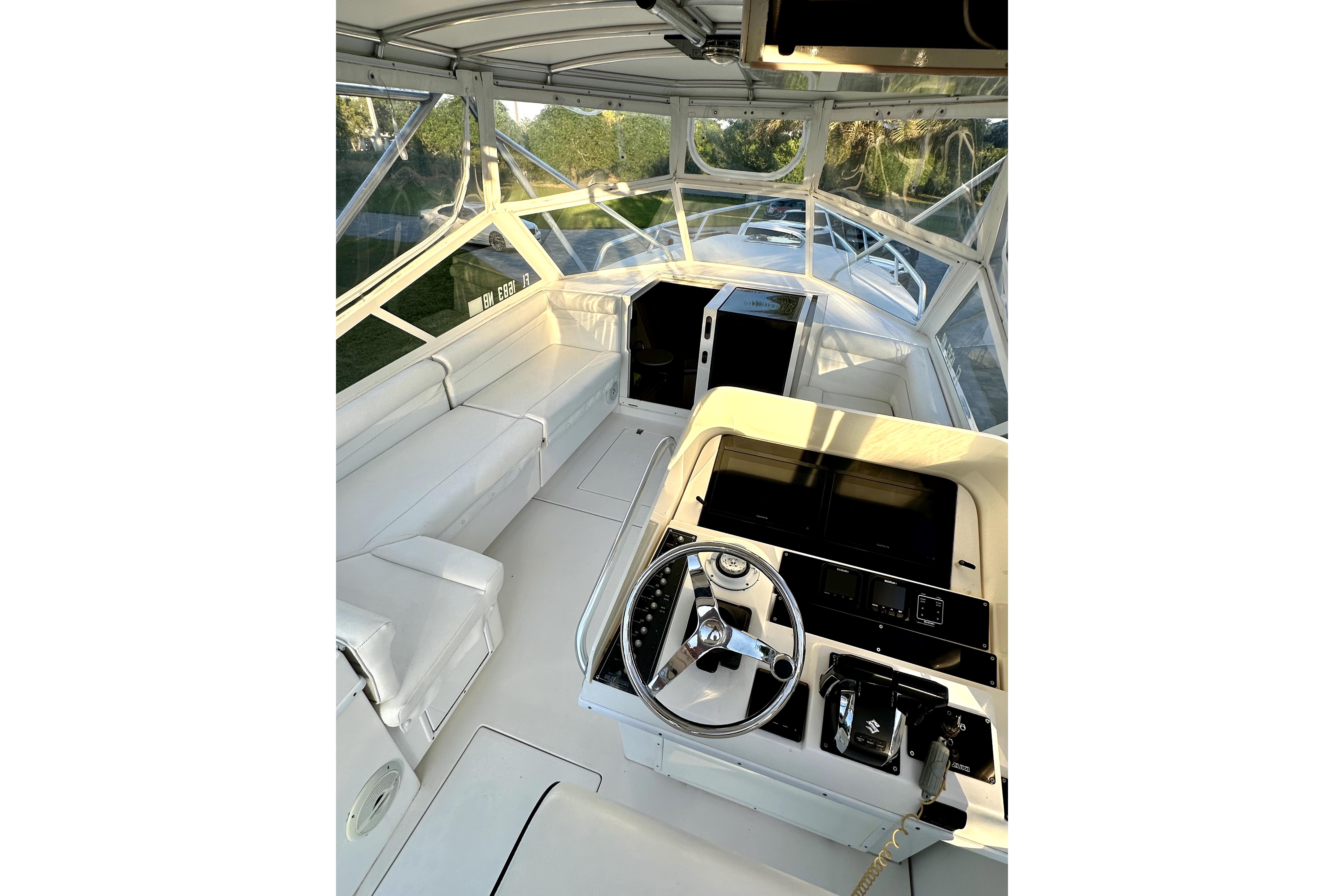 2006 Contender 35 Express Side Console interior with steering wheel and seating area.