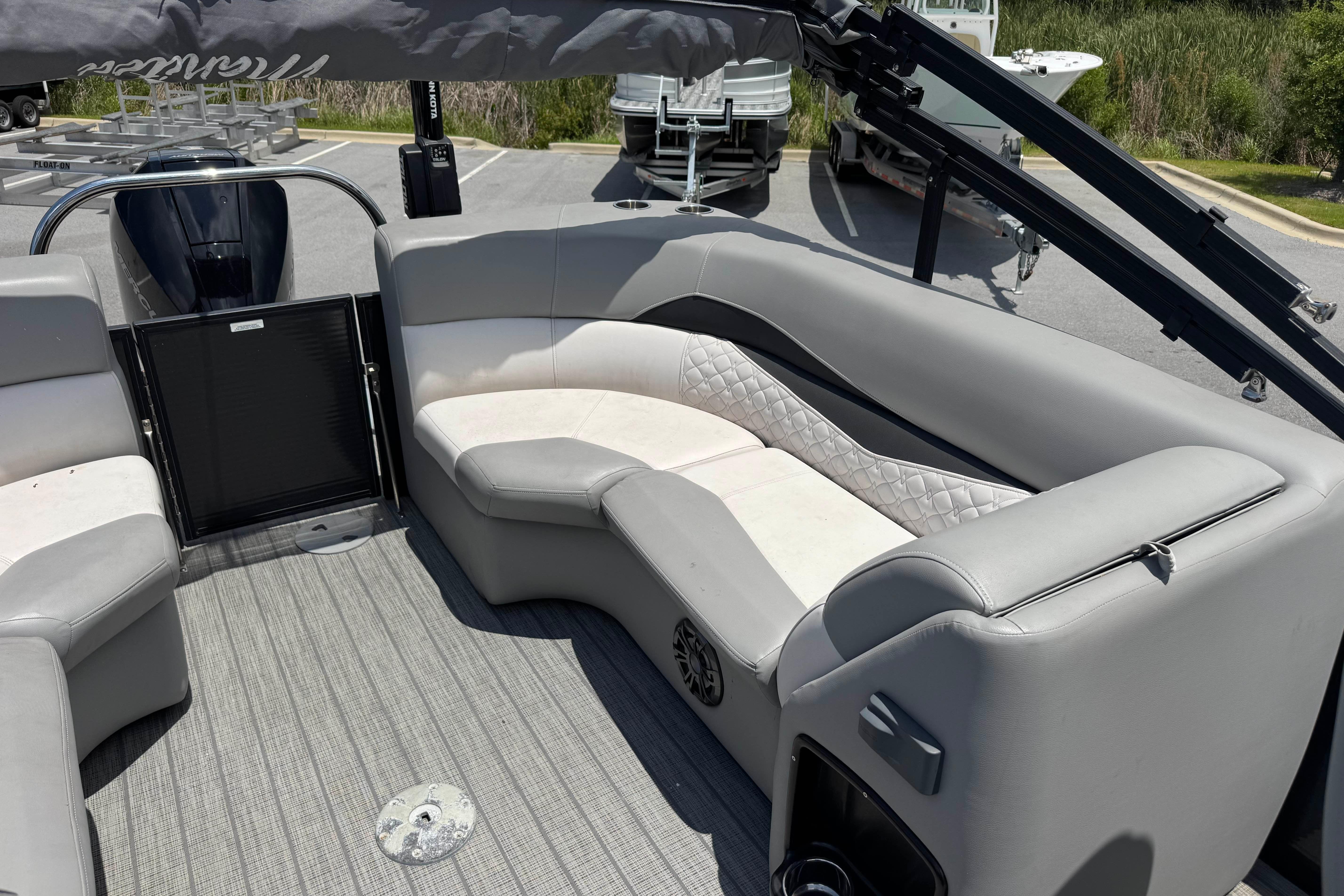 2022 Manitou 25 Encore pontoon boat interior with gray seating and quilted accents.