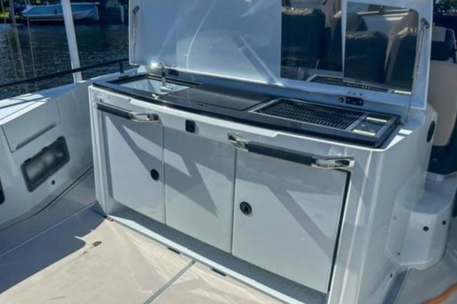 2023 BRABUS Shadow 900 ST yacht outdoor kitchen with grill and sink.