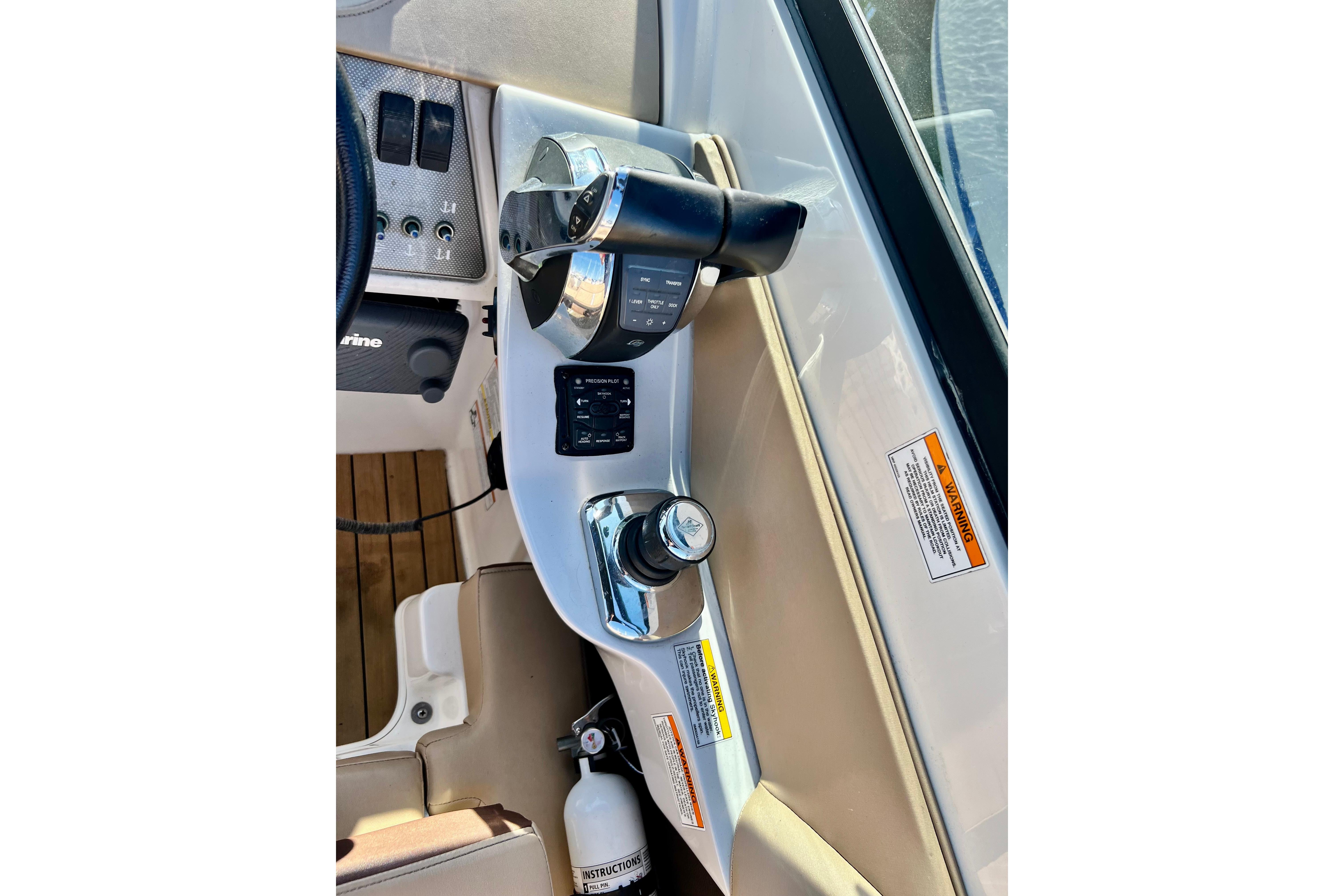 2016 Sea Ray 290 Sundeck Outboard helm controls with throttle and switches.