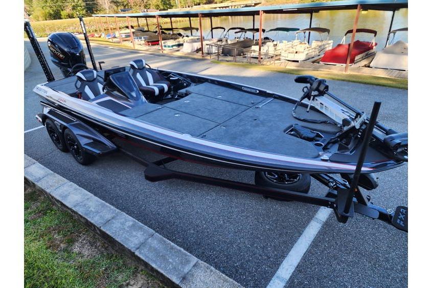 2026 Skeeter FXR21 Limited bass boat on trailer near a lake.
