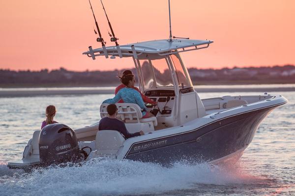 Manufacturer Provided Image: 2018 Grady-White Fisherman 216 boat cruising at sunset with passengers.