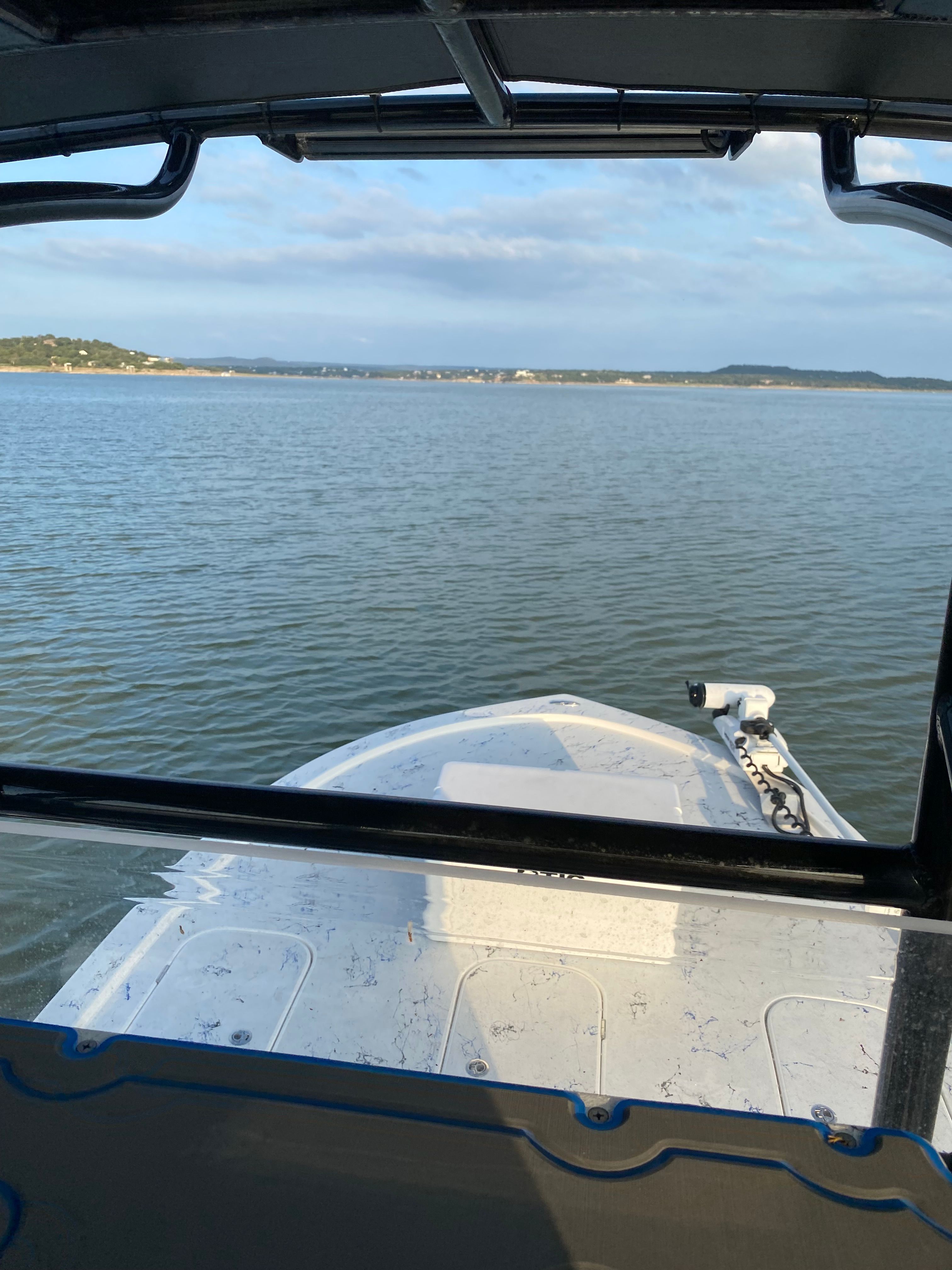 Shallow Sport 25 X3 boat on calm waters, 2023 model.