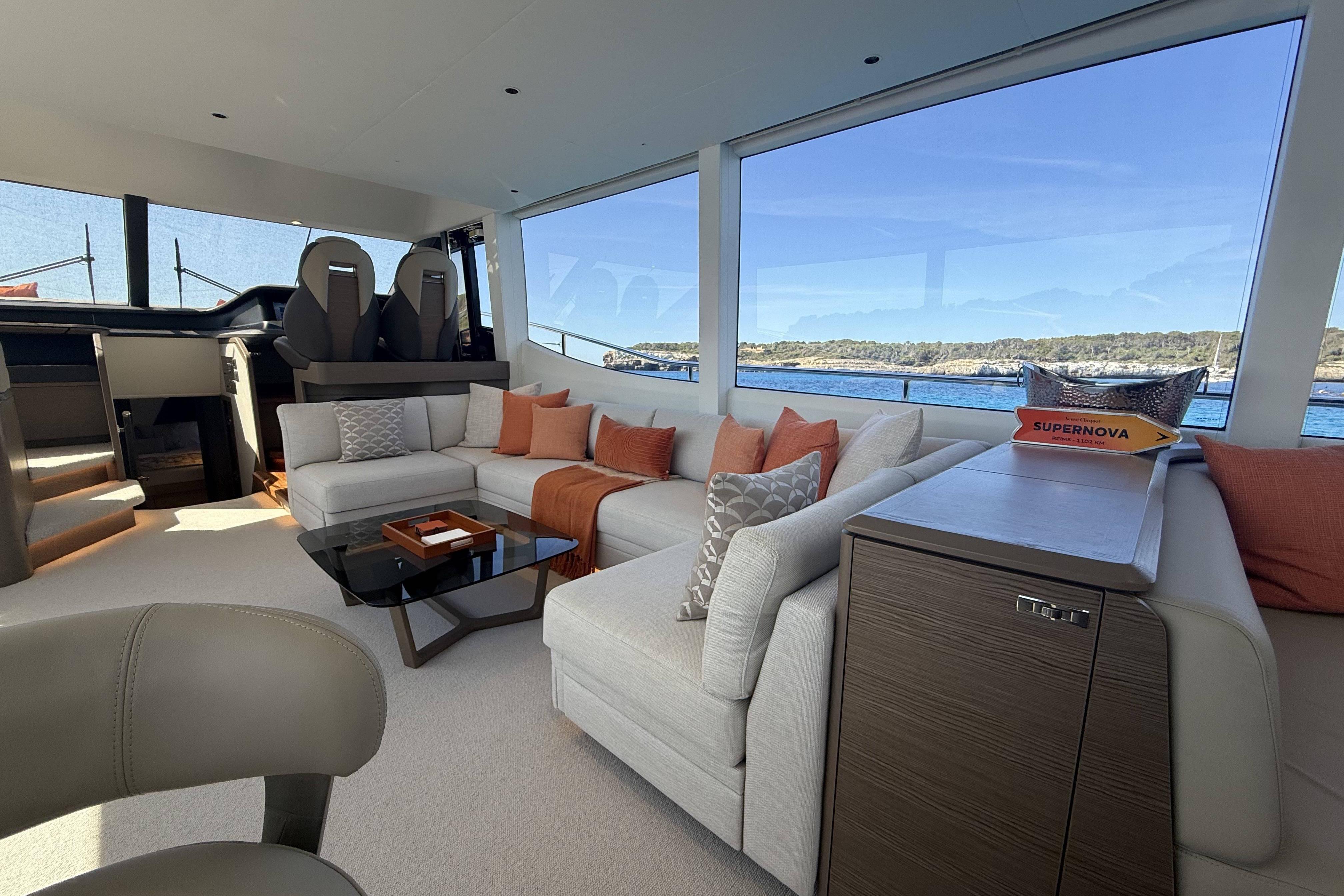 Luxurious interior of 2025 Princess Y72 yacht with elegant seating and scenic ocean view.