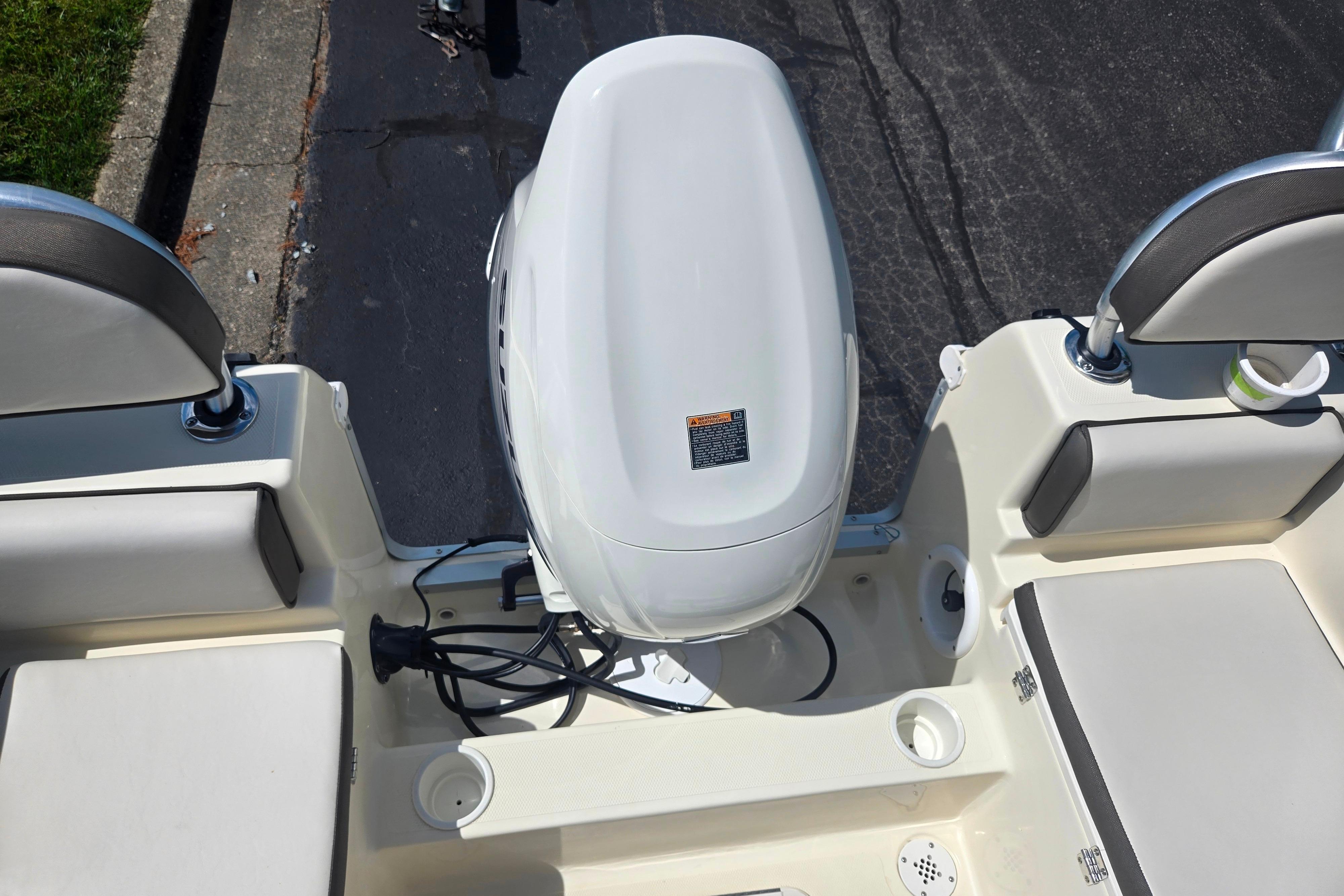 2016 Key Largo 2000CC boat with outboard motor and seating area.