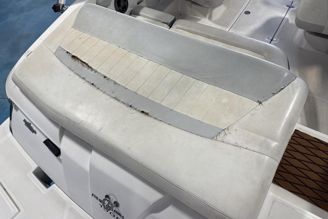 Worn seat upholstery on 2012 Regal 1900 Bowrider boat, showing visible damage and wear.