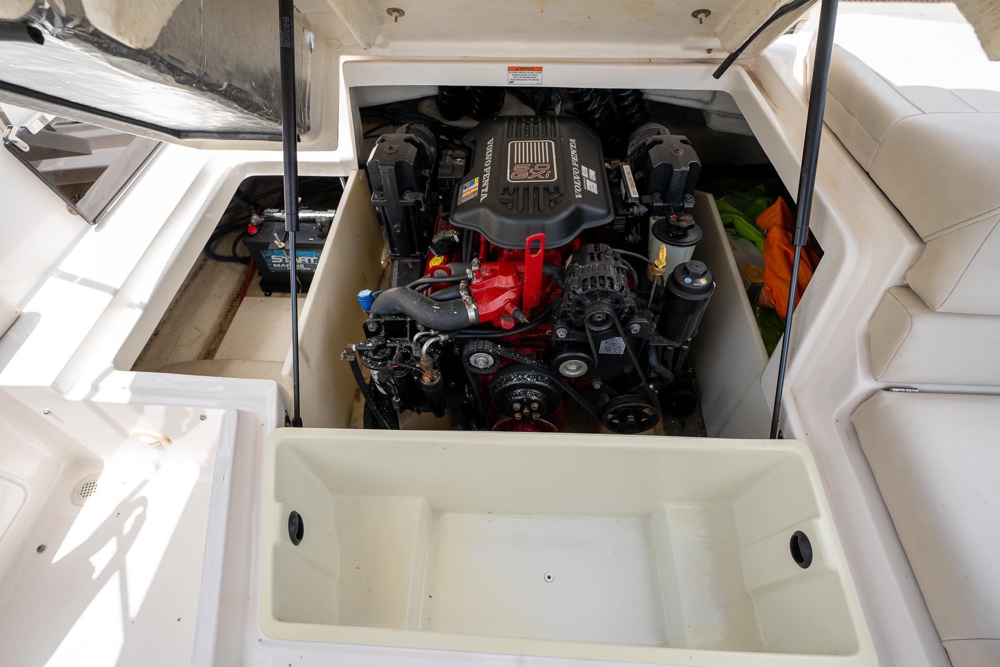 Engine compartment of a 2008 Regal 2000 Bowrider boat, showcasing the motor and components.