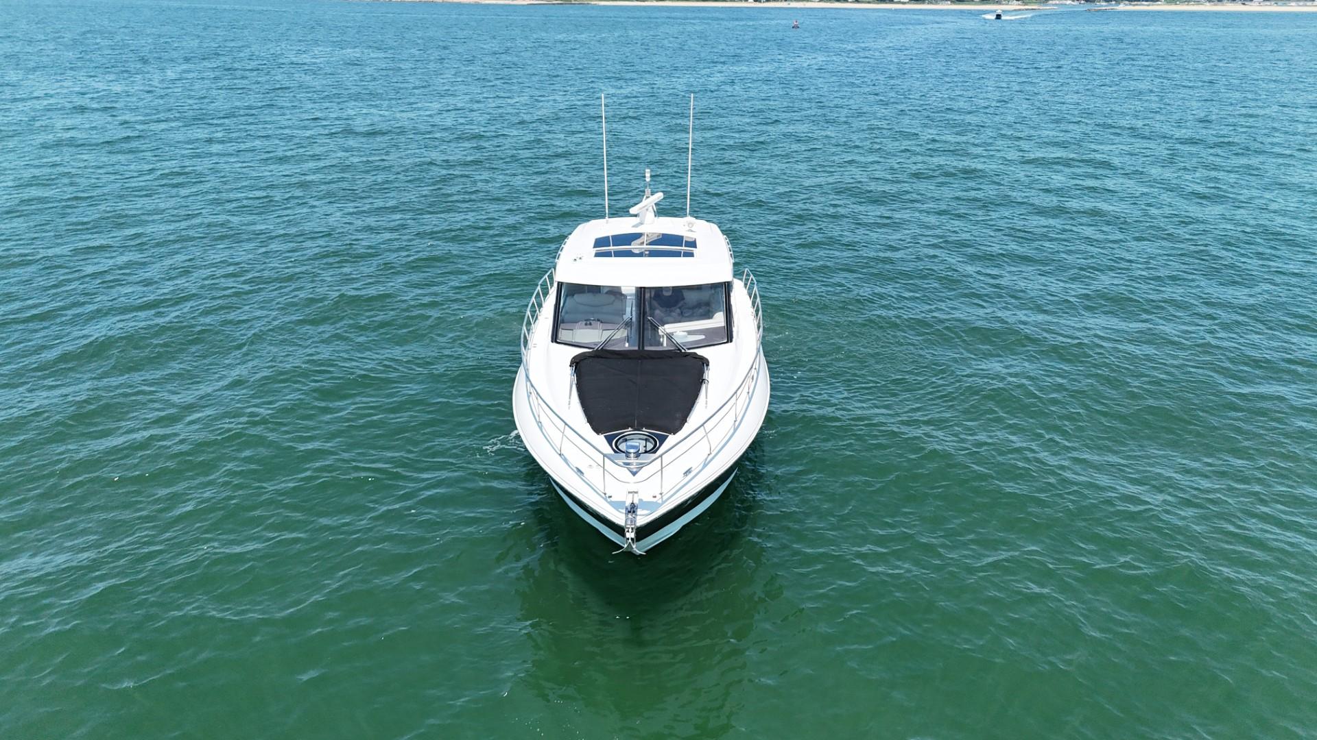 2015 Cruisers Yachts 45 Cantius on open water, aerial view.