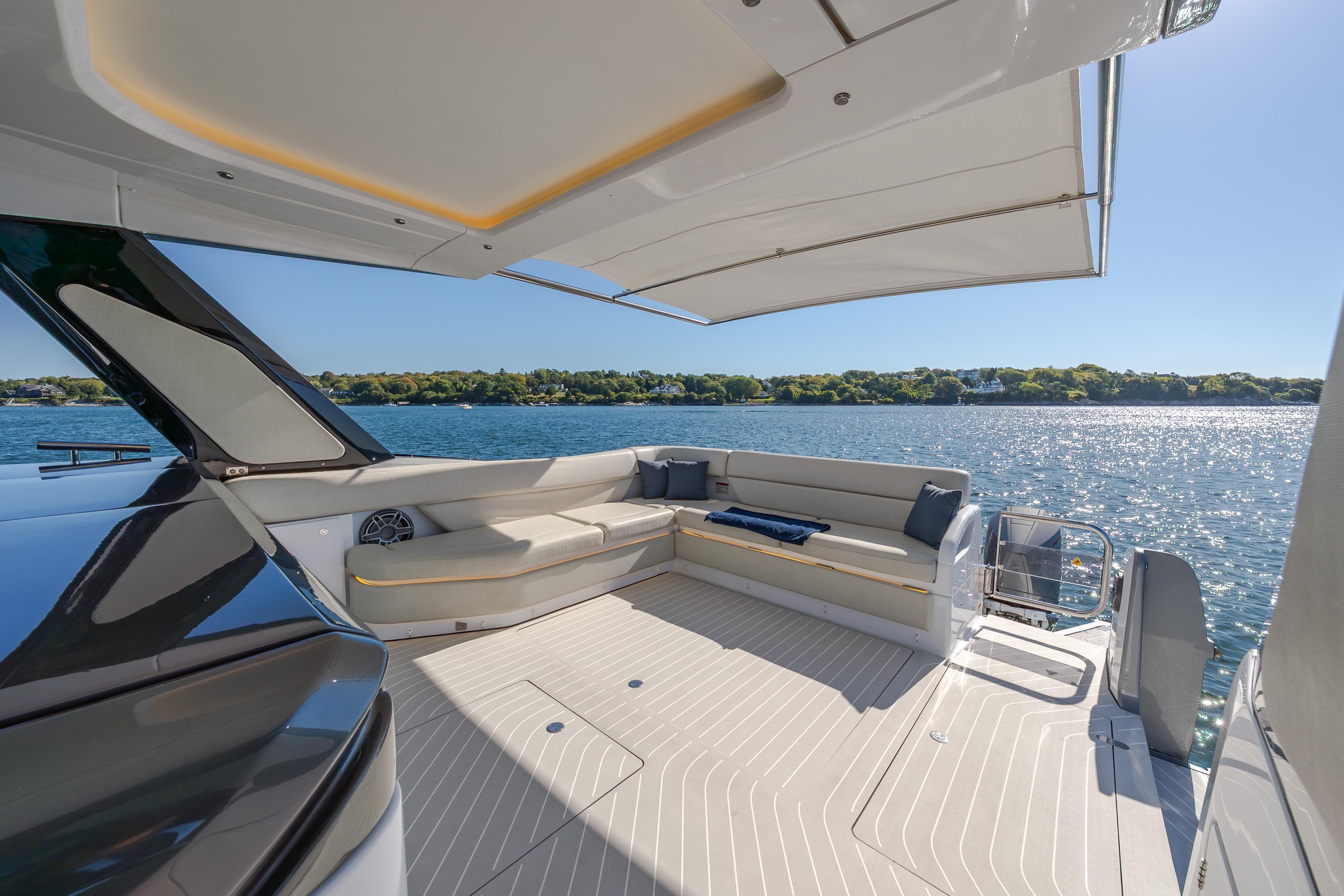 Luxurious deck of 2023 Azimut Verve 47 yacht with scenic water view.