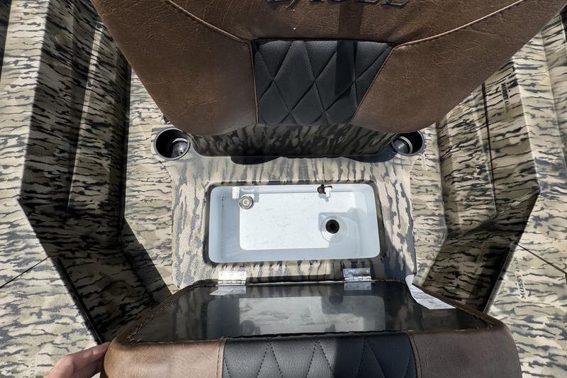 Interior view of 2027 Excel 230 Bay Pro Elite boat with storage compartment.