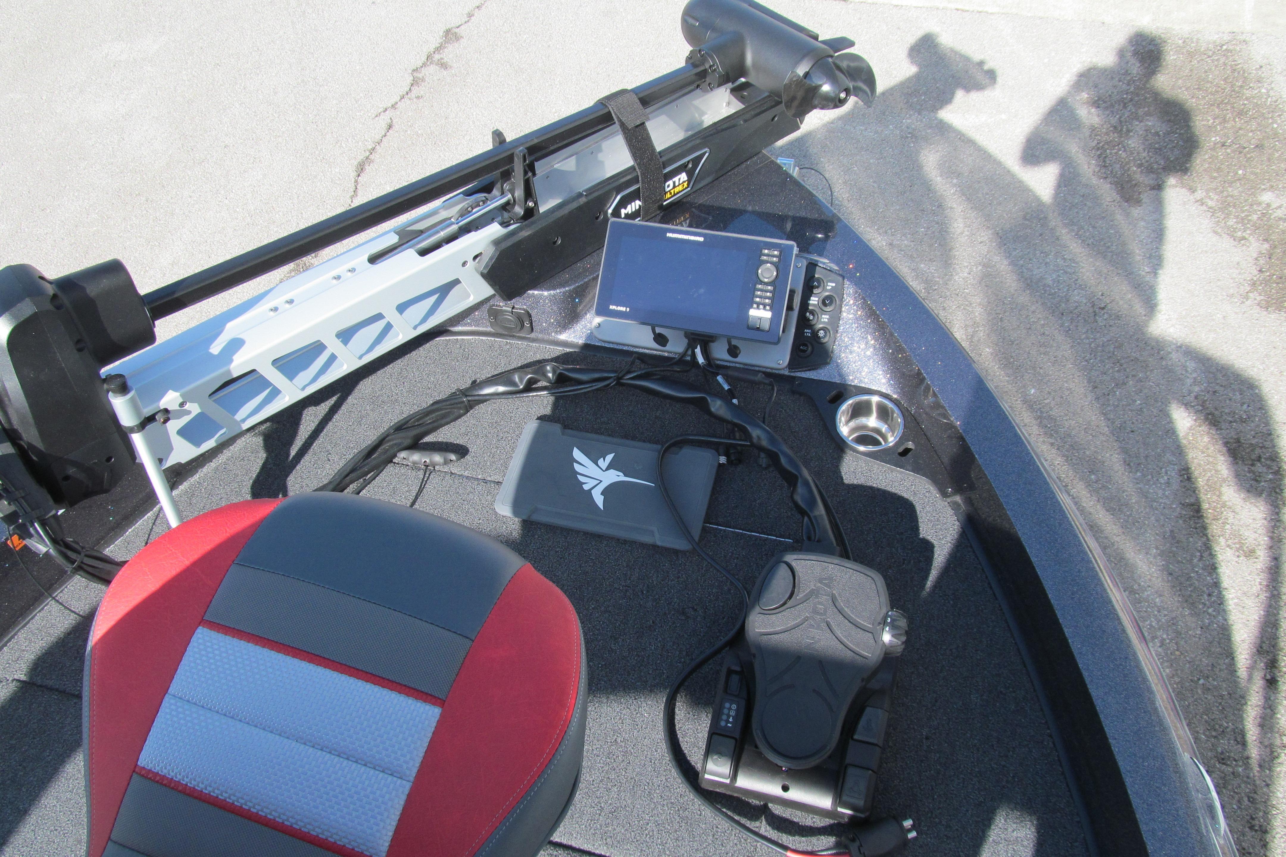 2026 Ranger 212LS boat interior with red seat, control panel, and electronic equipment.