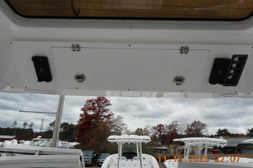 Interior view of 2025 Sea Fox 288 Traveler boat with control panel and storage compartments.