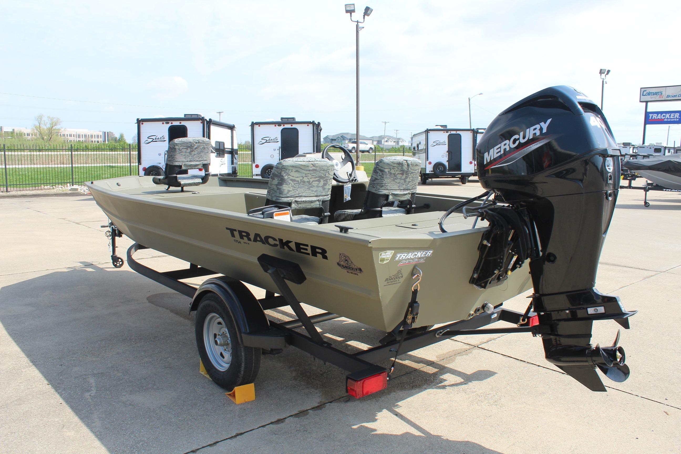 2026 Tracker Grizzly 1754 SC boat with Mercury engine on trailer in outdoor setting.