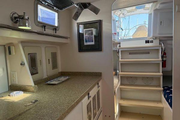 Interior of 2011 Reliance 44 yacht with stairs, countertop, and window.