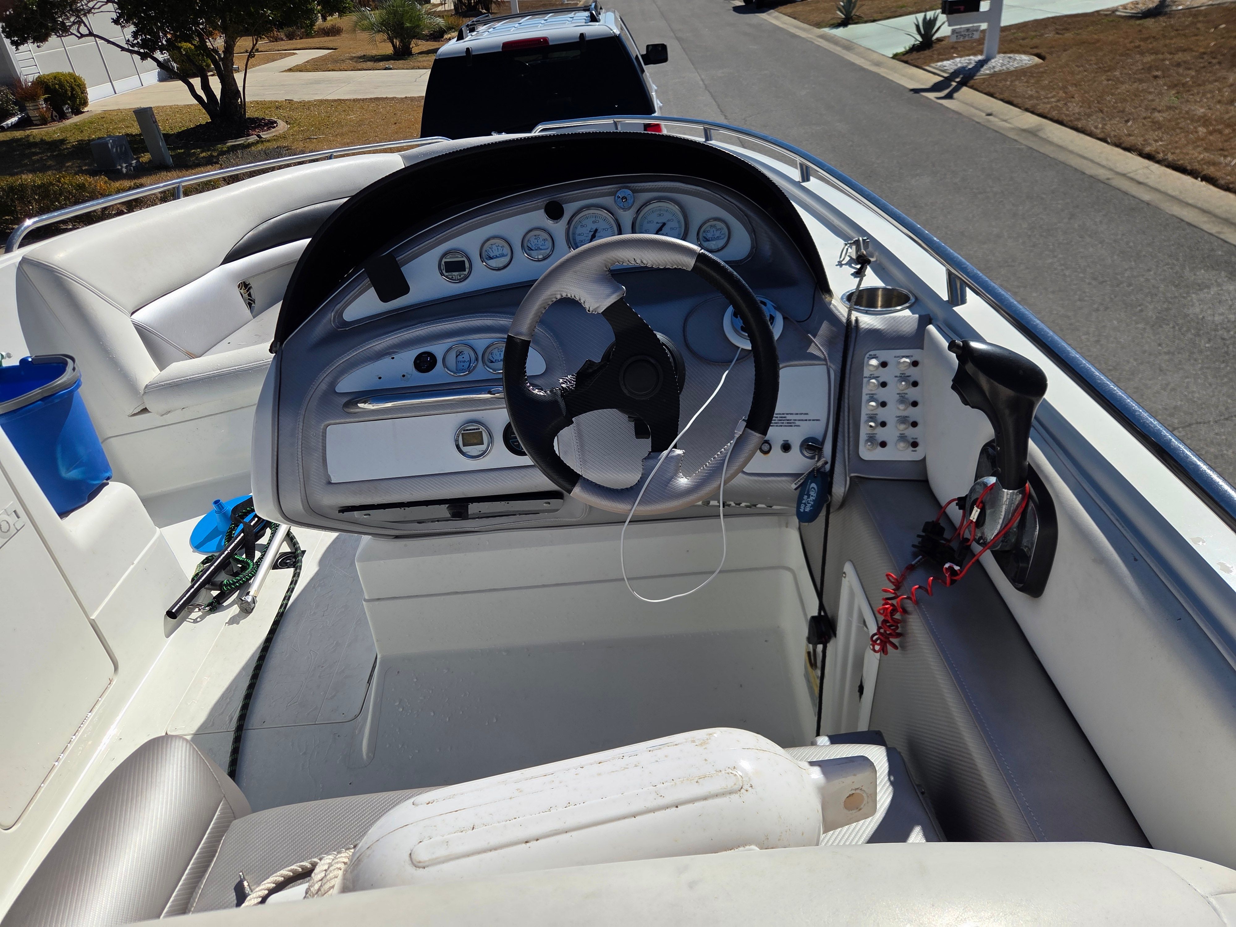 Interior view of a 1997 Cobalt 23LS boat with steering console.