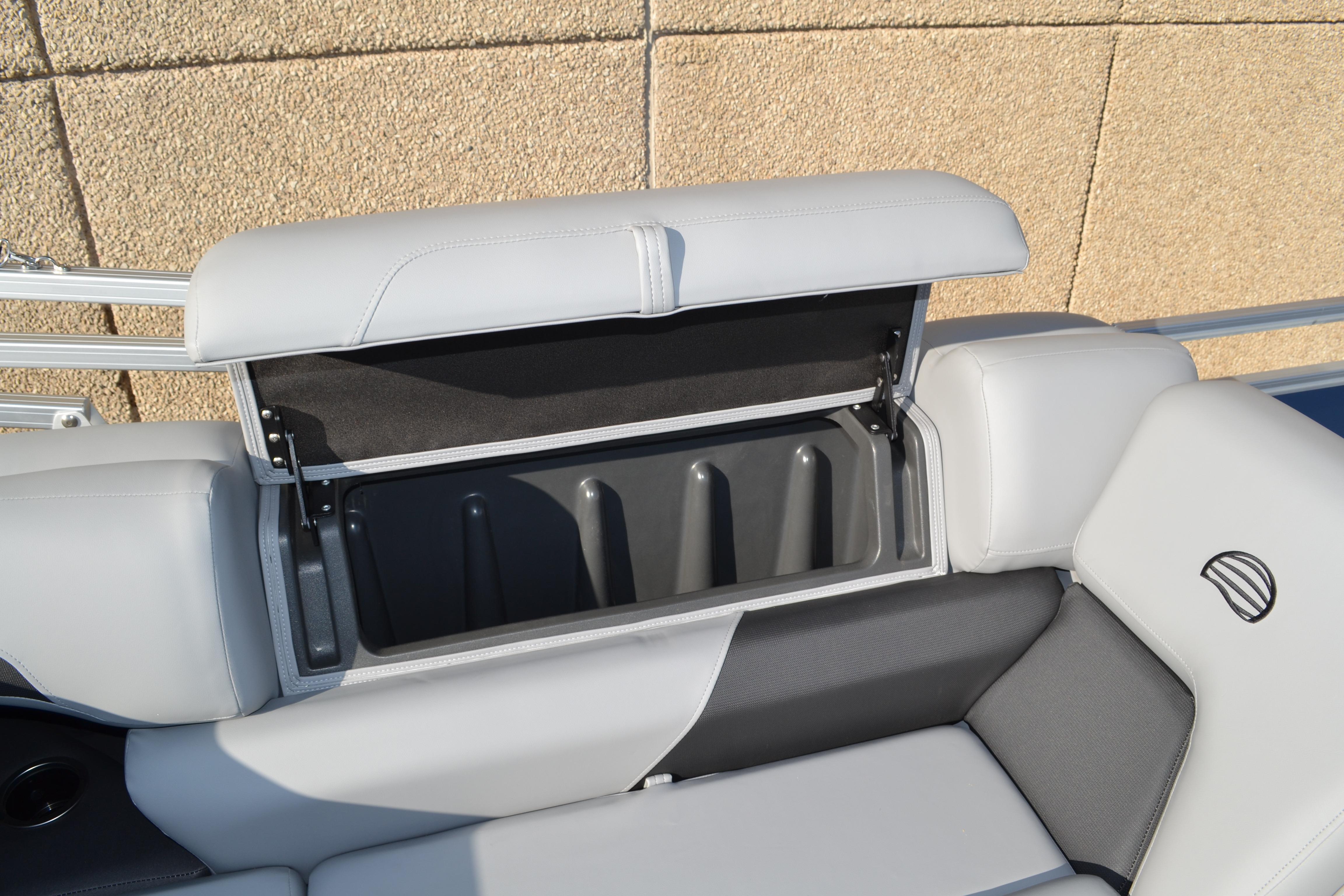 2026 Sun Tracker SportFish 22 XP3 boat seat with open storage compartment.