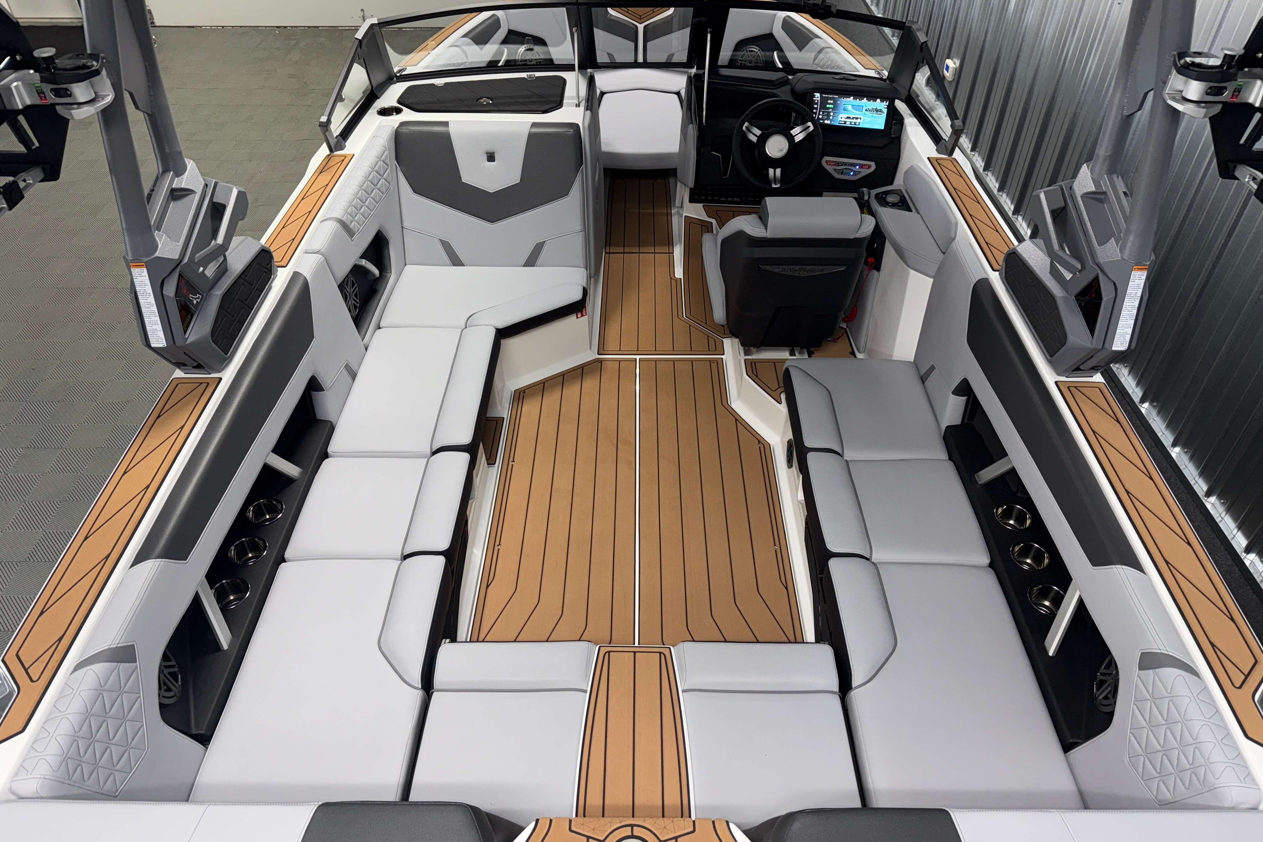 2026 Nautique Super Air Nautique GS22 interior with sleek seating and modern dashboard.