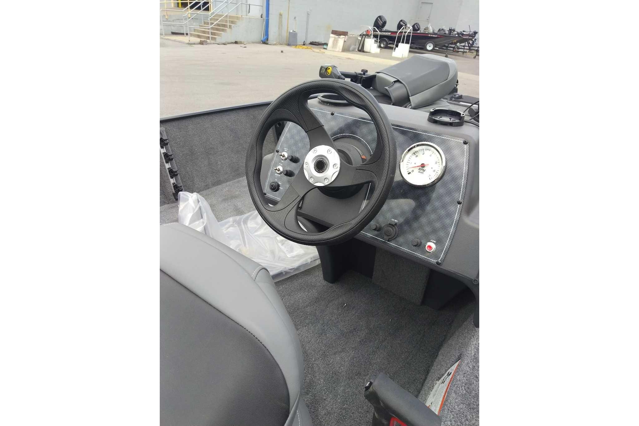 2026 Tracker Bass Tracker Classic XL boat interior with steering wheel and dashboard.