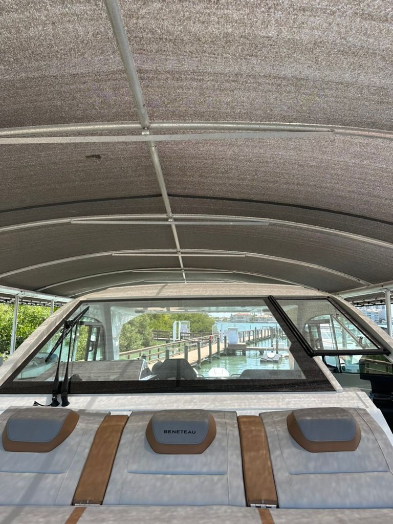 2024 Beneteau Gran Turismo 32 under canopy at dock.