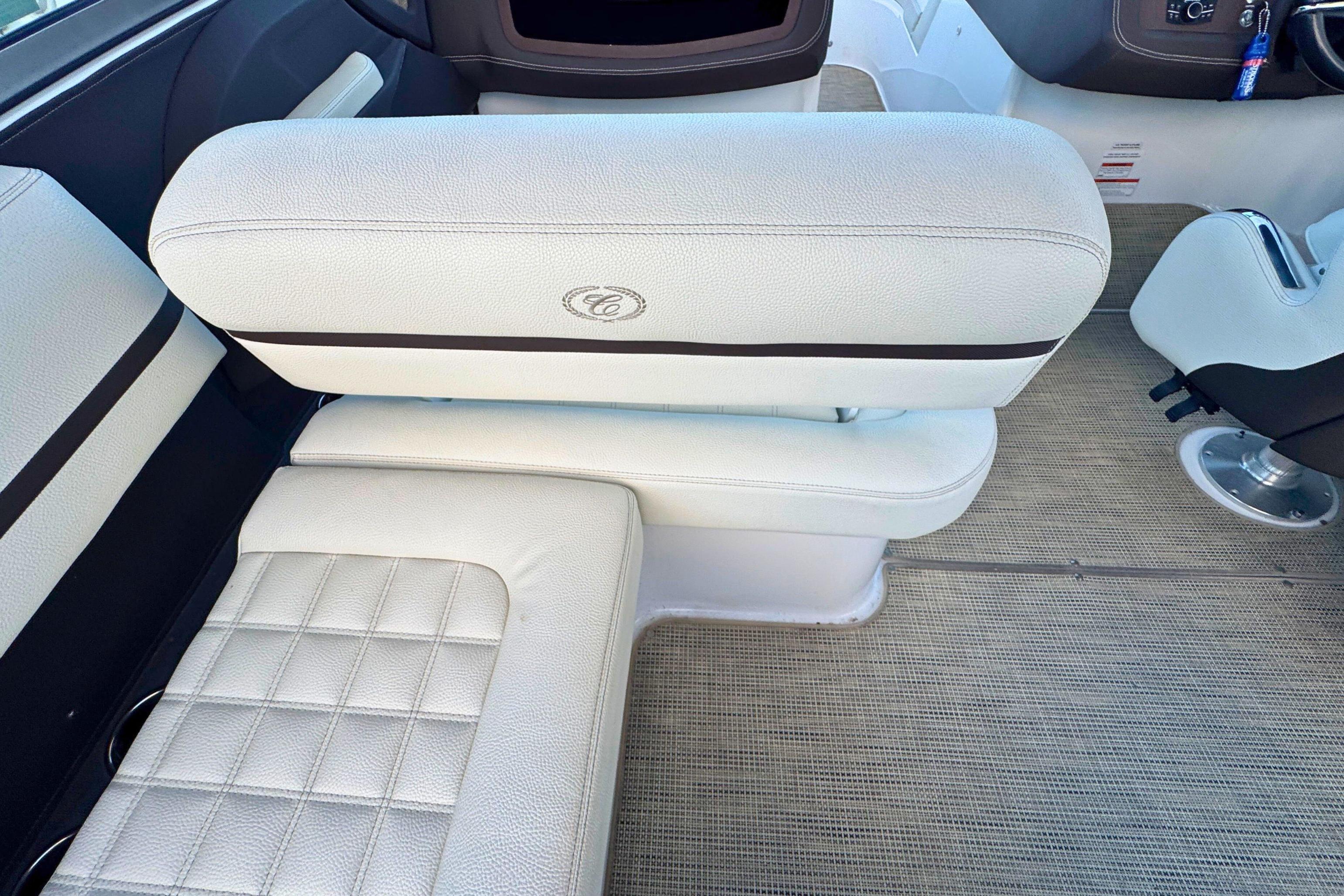 2019 Cobalt R3 boat interior with white cushioned seating and carpeted flooring.