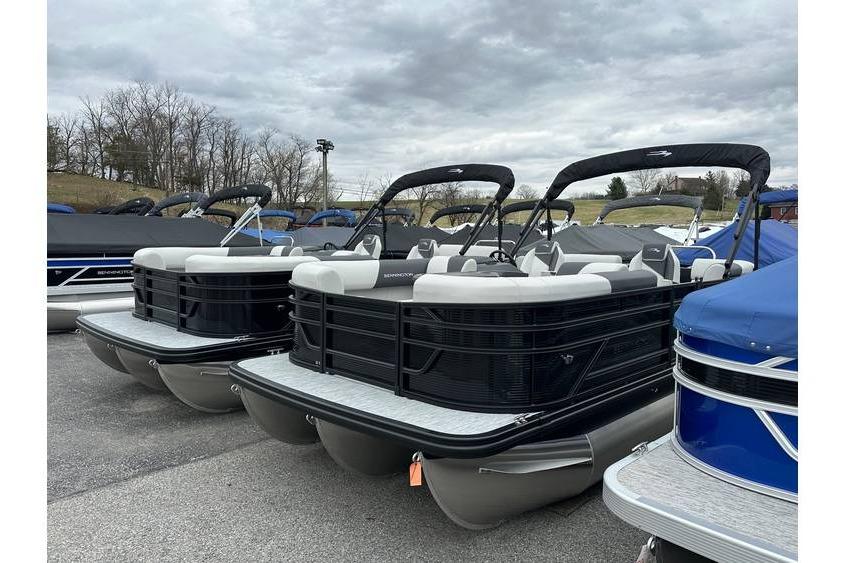 2026 Bennington 20 SSR Quad Bench Tritoon with Yamaha 115 HP, in stock, displayed outdoors.