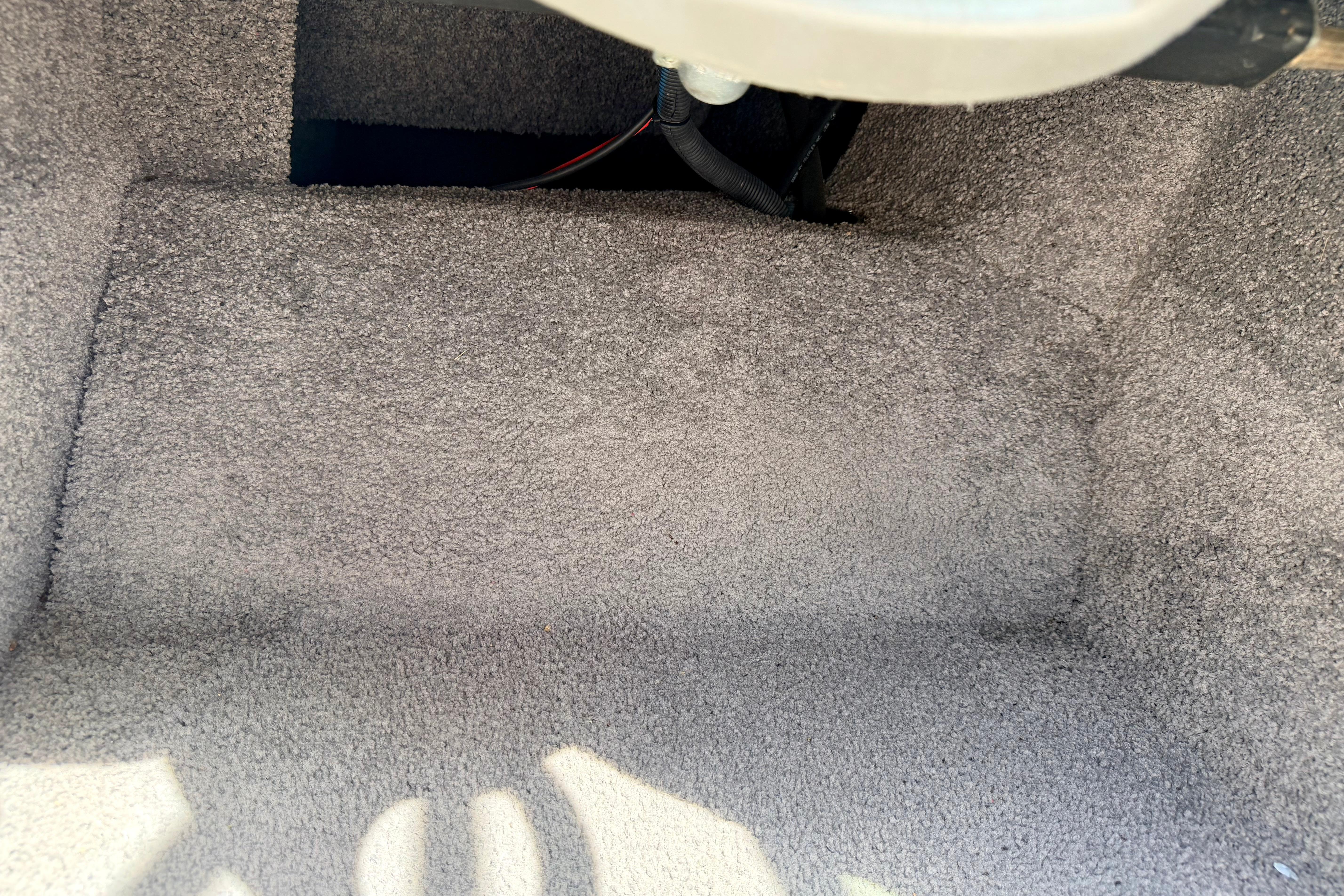 Carpeted interior of a 2008 Moomba Outback V boat, showcasing clean and well-maintained flooring.