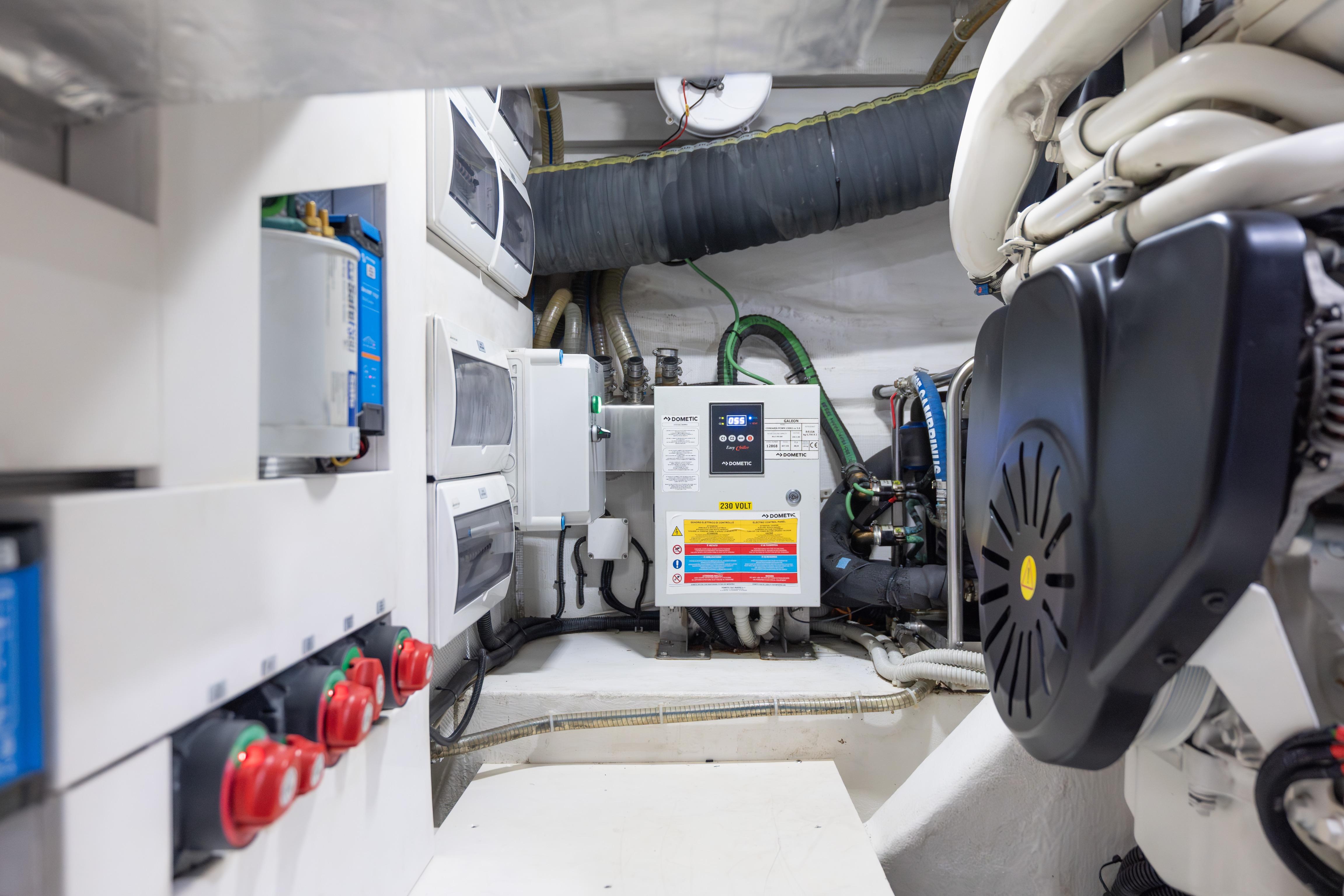 Engine room of 2020 Galeon 500 Fly yacht, showcasing electrical systems and components.
