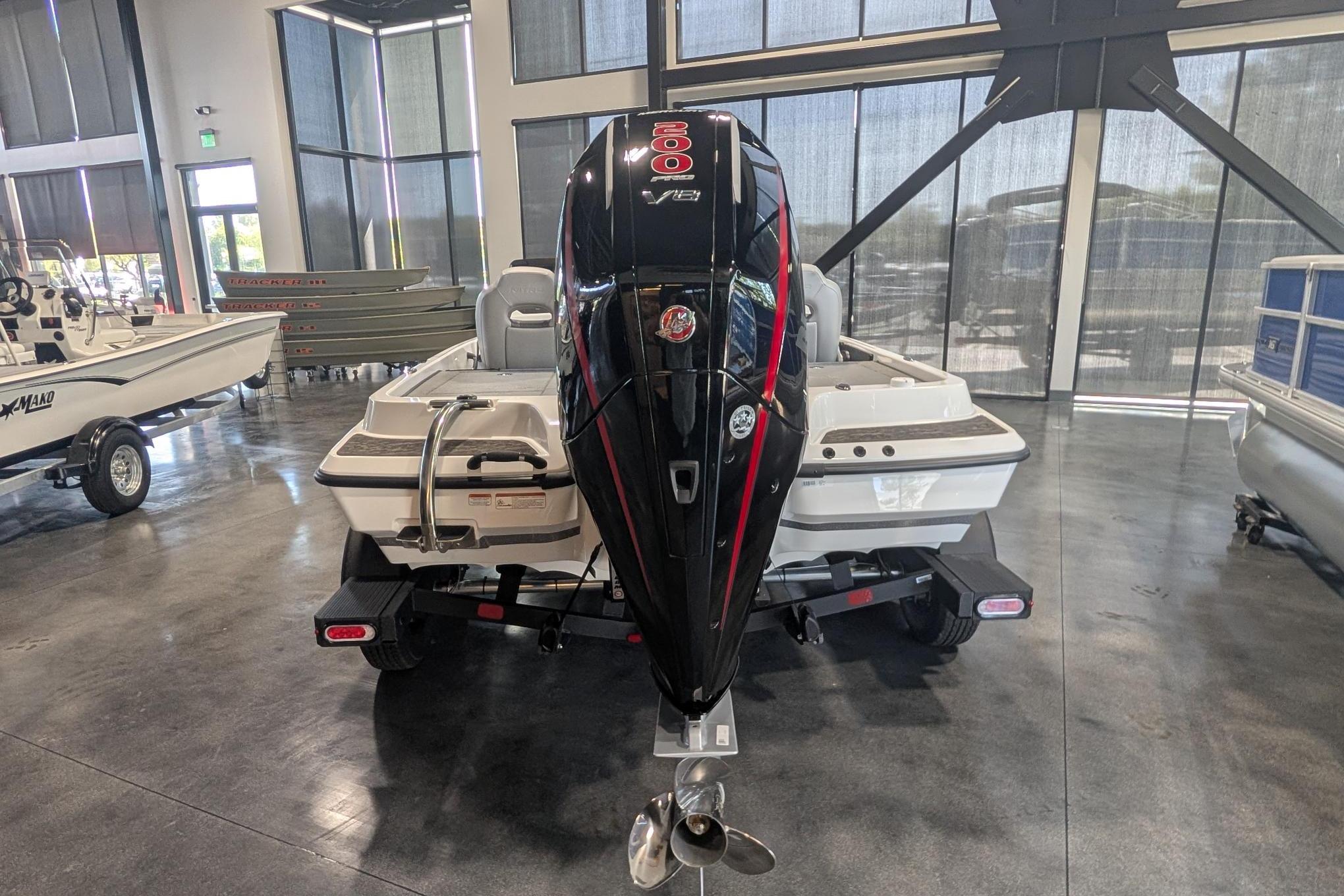 2026 Nitro Z19 XL Pro boat with powerful outboard motor in showroom.