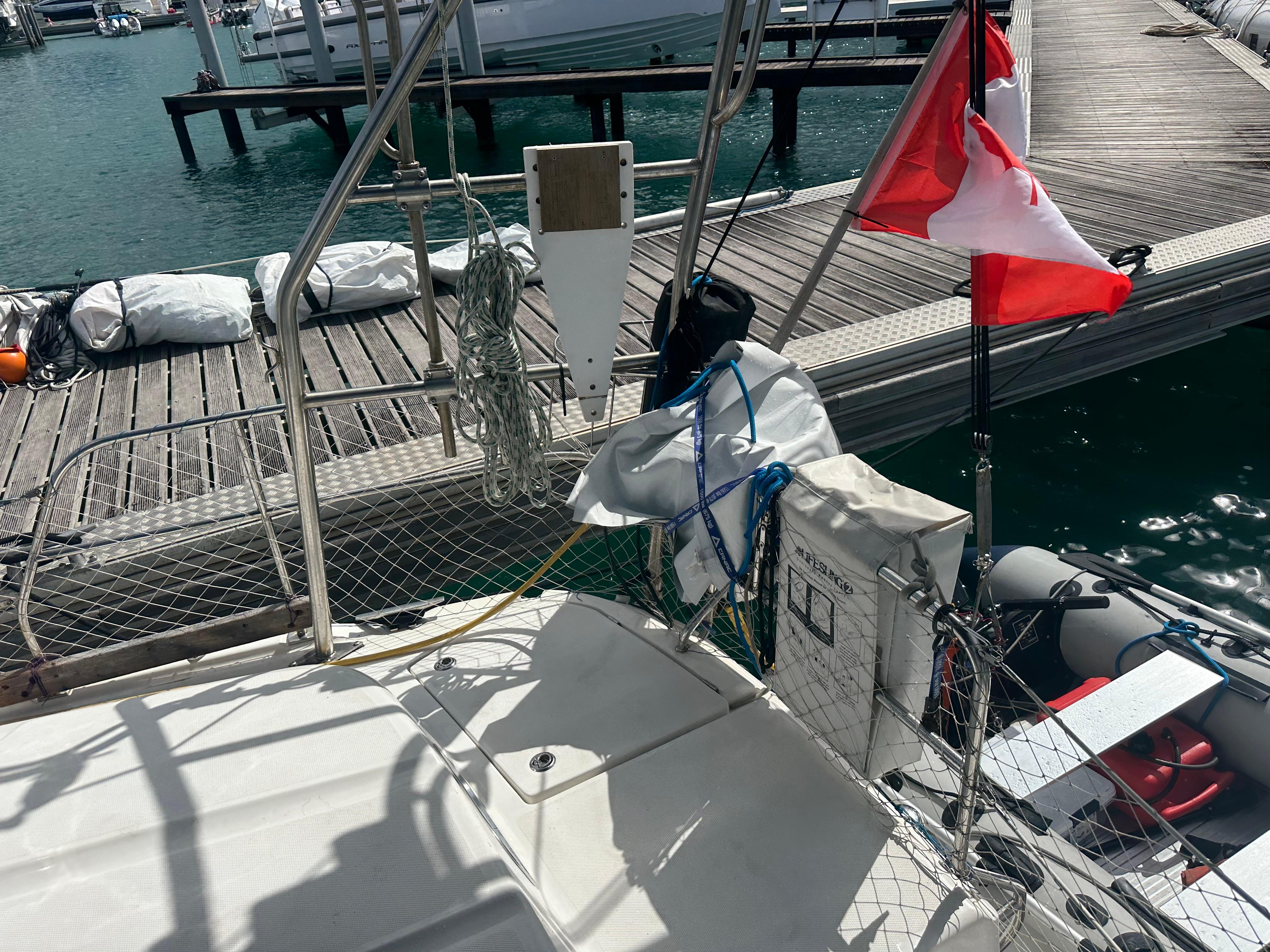 Sailboat docked at marina with Canadian flag, Hunter 45cc, 2006 model.