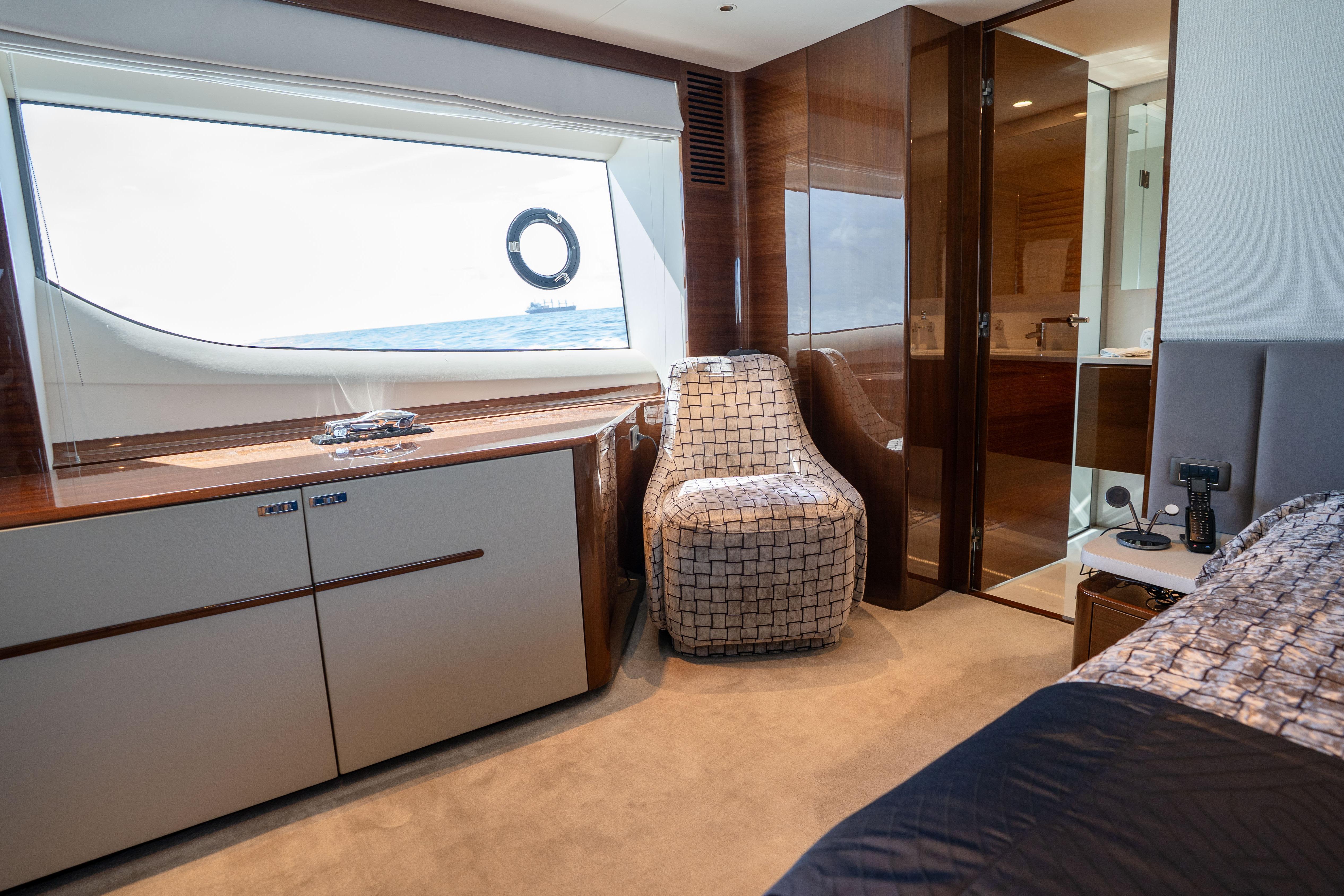 Luxurious interior of 2020 Princess Y85 yacht with elegant furnishings and ocean view.