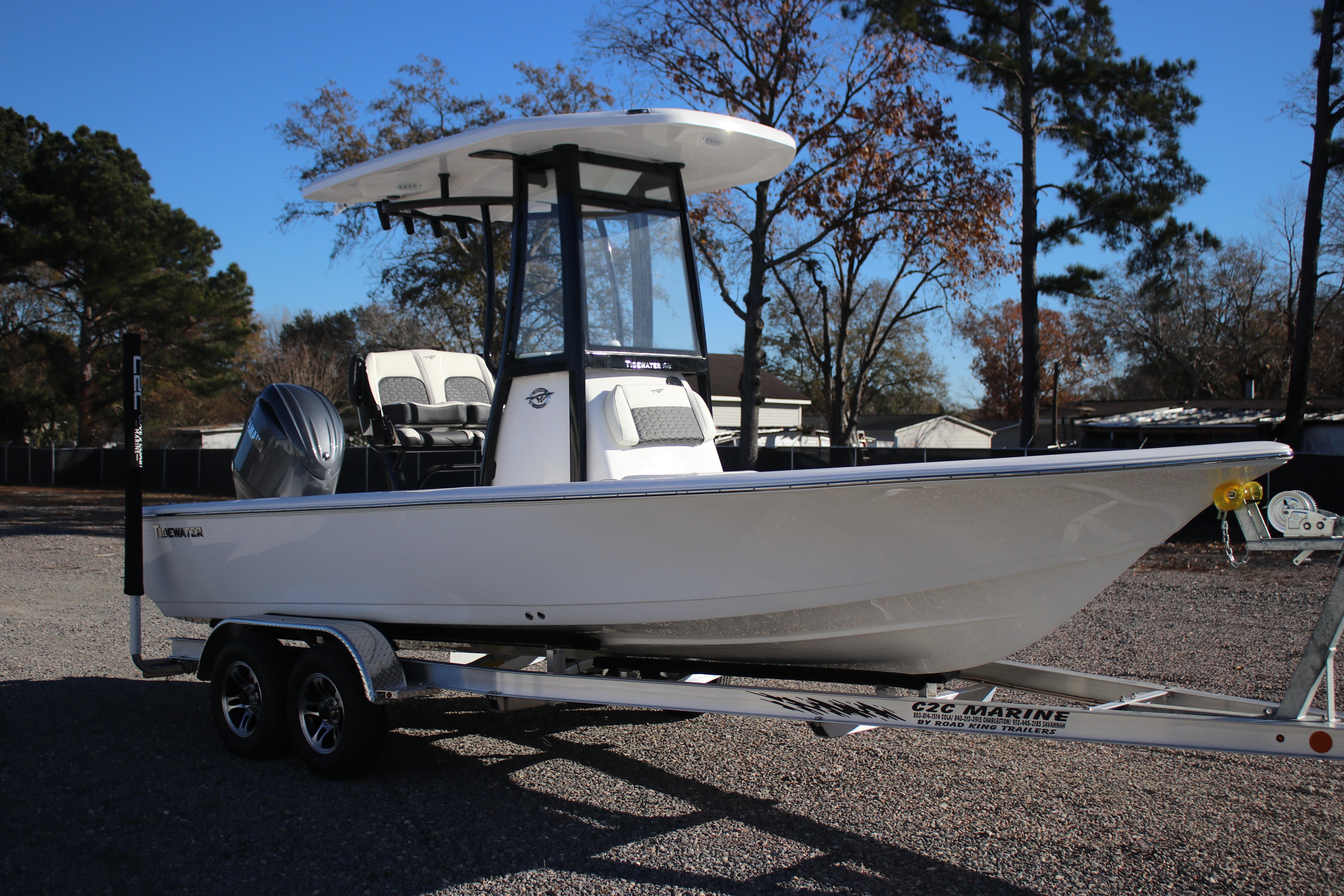 2026 Tidewater 2210 Carolina Bay boat on trailer, parked outdoors.