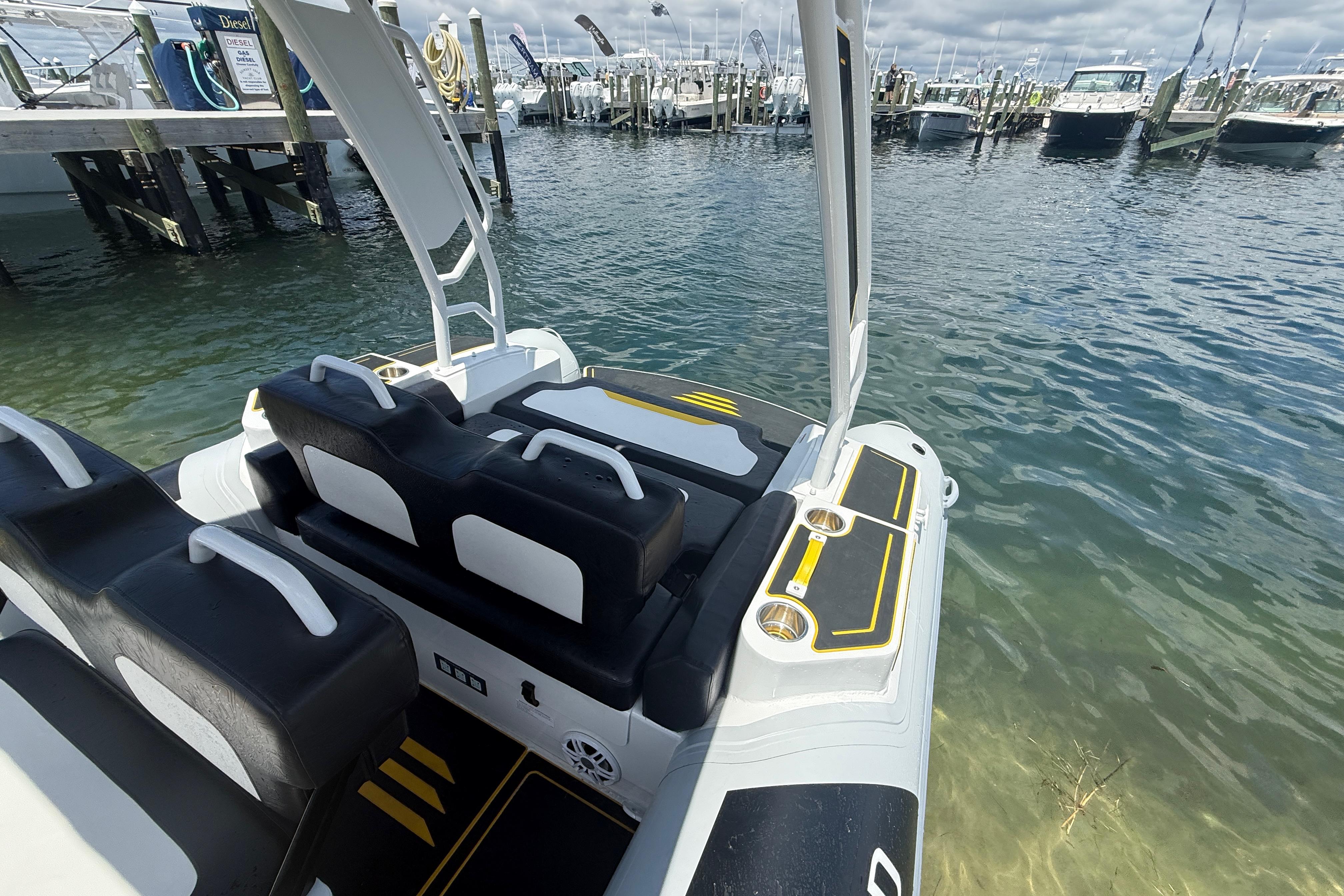 Highfield Velox 560 boat docked, showcasing sleek seating and modern design, 2026 model.