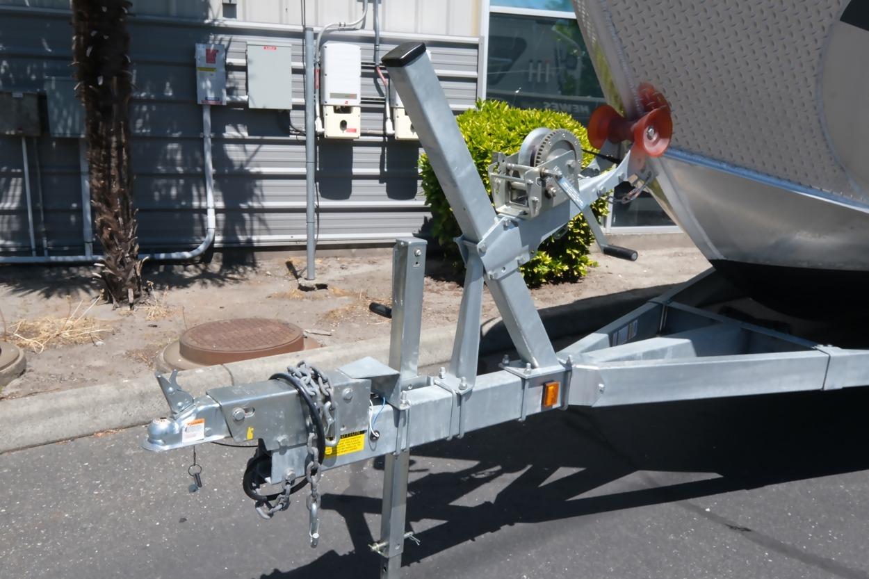 Trailer hitch of 2018 Hewescraft 220 Ocean Pro ET Hardtop boat in parking lot.