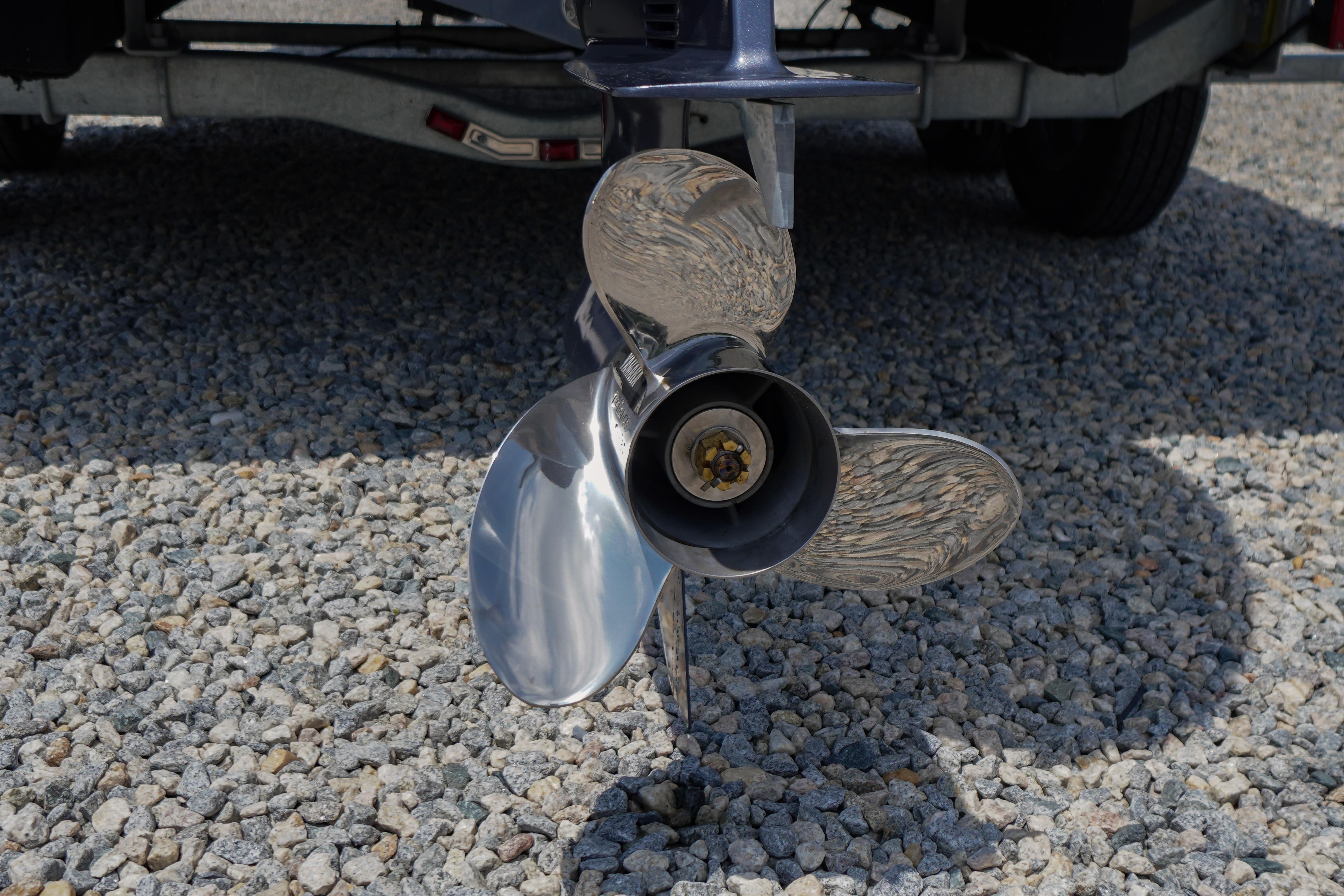 Propeller of 2027 Tidewater 220 CC Adventure boat on gravel surface.