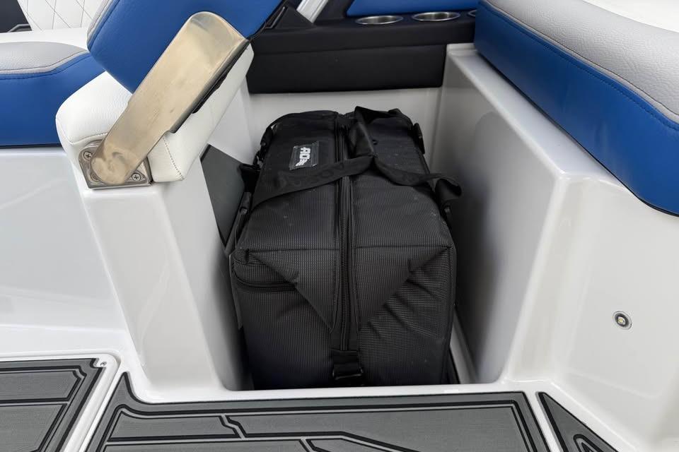 2026 Tigé Z3 boat interior with black bag in storage compartment.