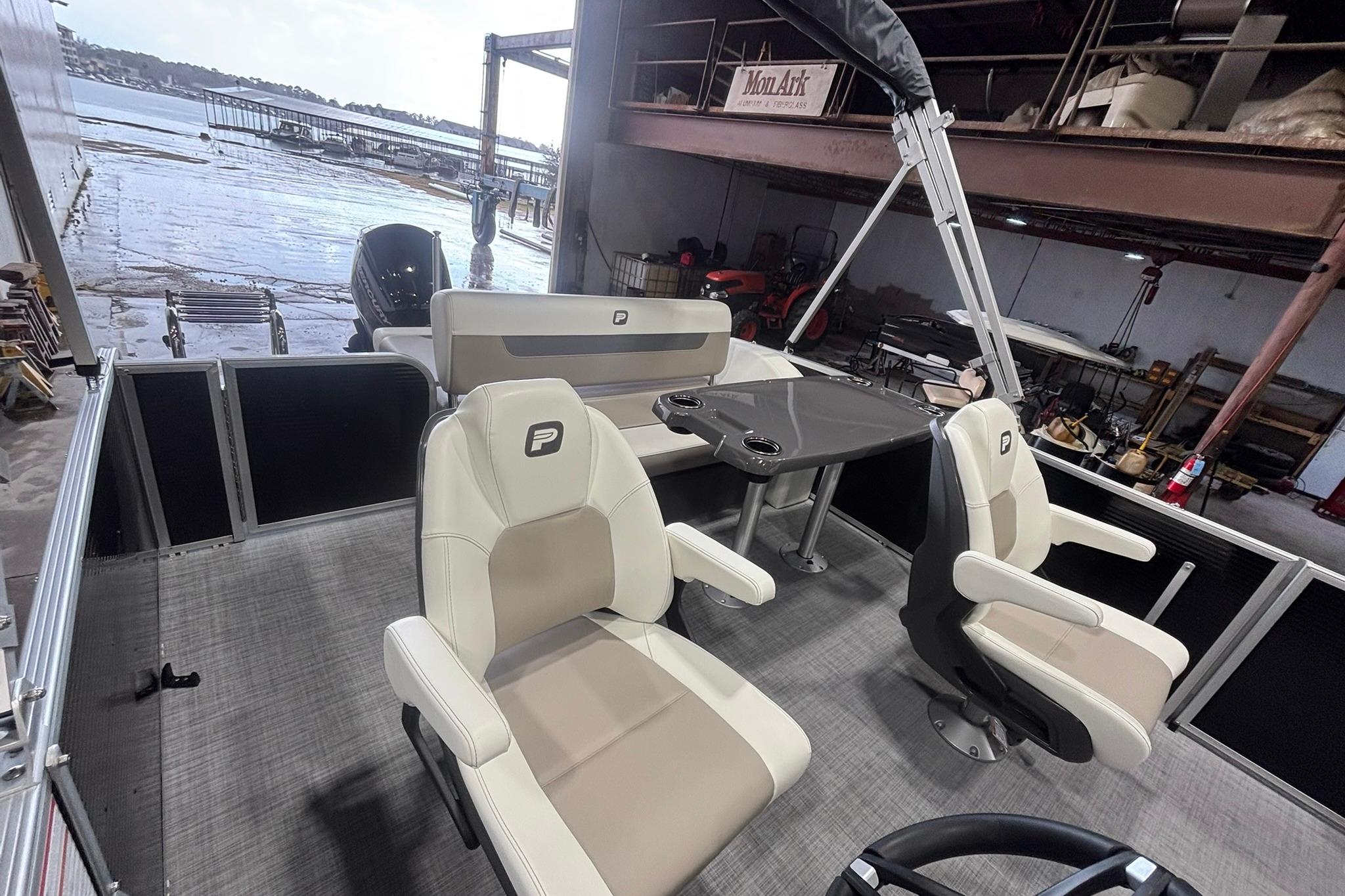 2025 Princecraft Vectra 21 RL pontoon boat interior with seating and table.