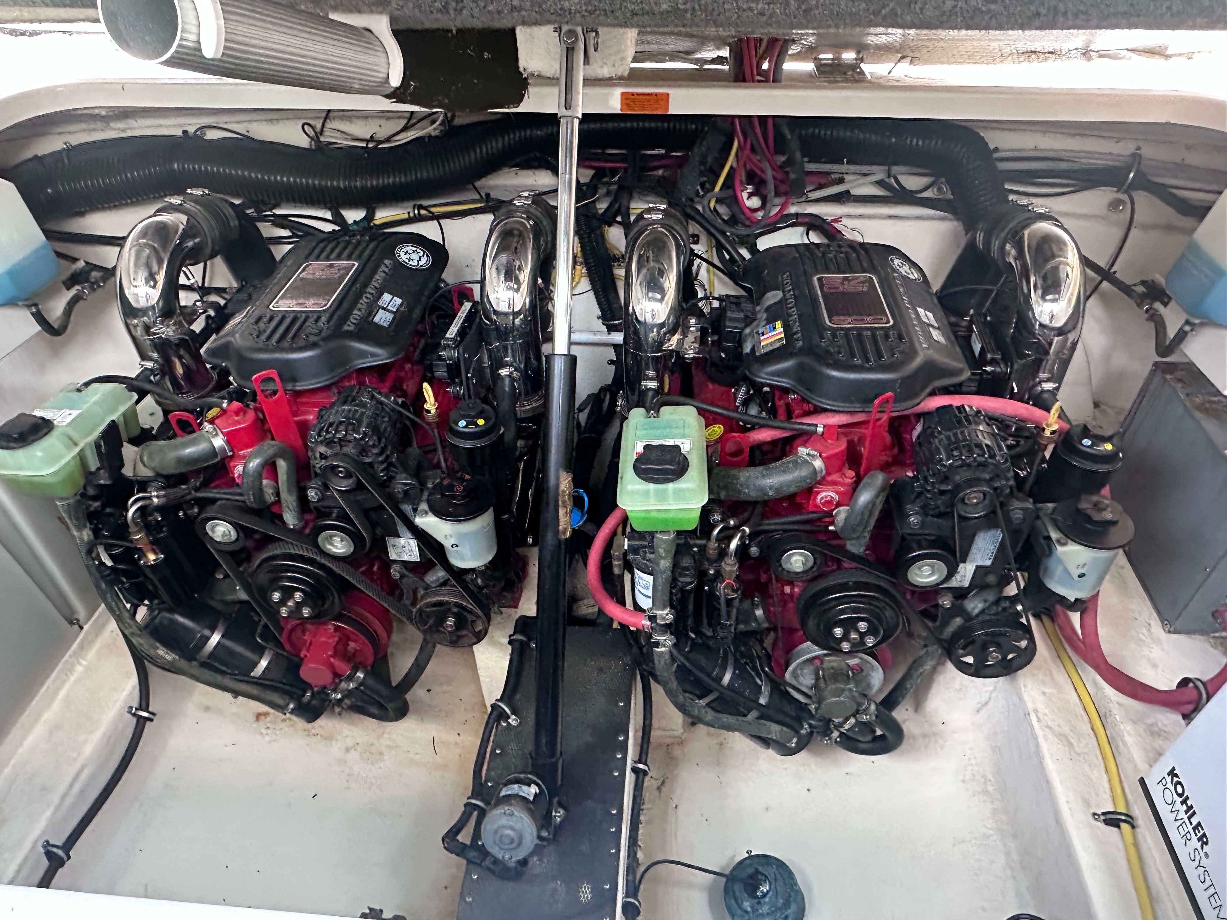 Two powerful engines in the engine room of a 2008 Chaparral Signature 330 boat.