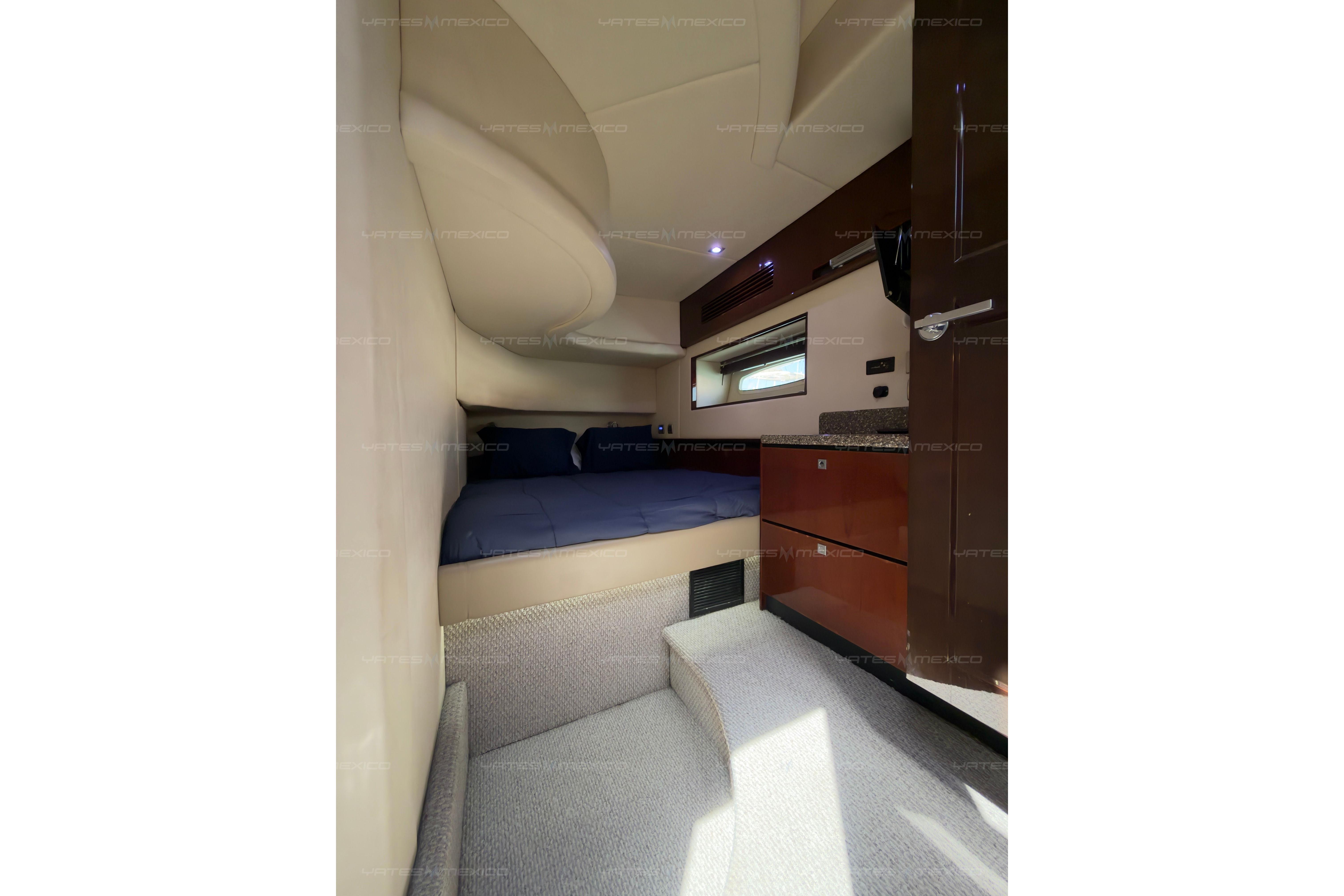 2008 Sea Ray 480 Sedan Bridge cabin interior with bed, window, and storage.