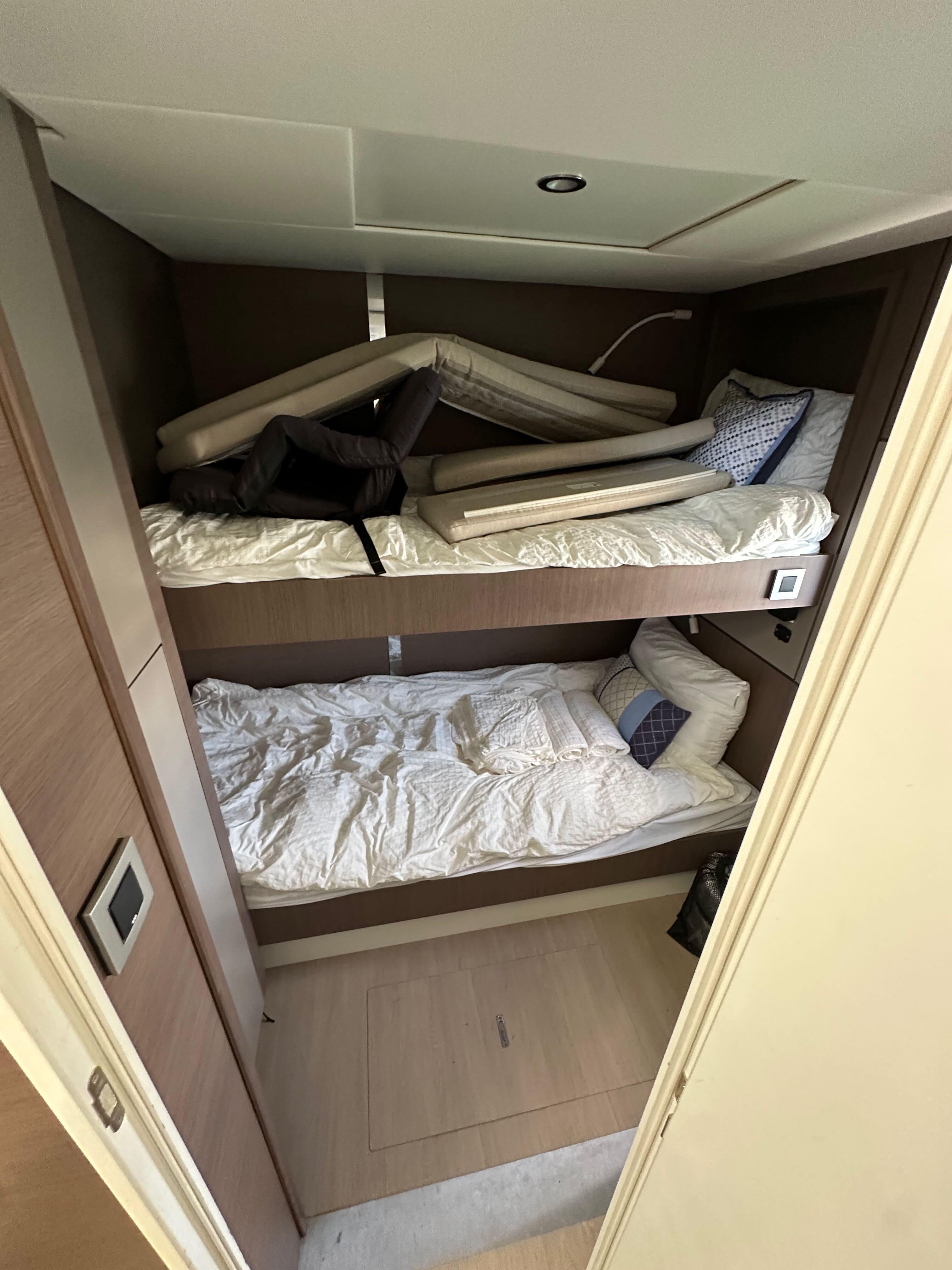 Bunk beds in a 2021 Bali 4.8 yacht cabin with modern design and cozy bedding.