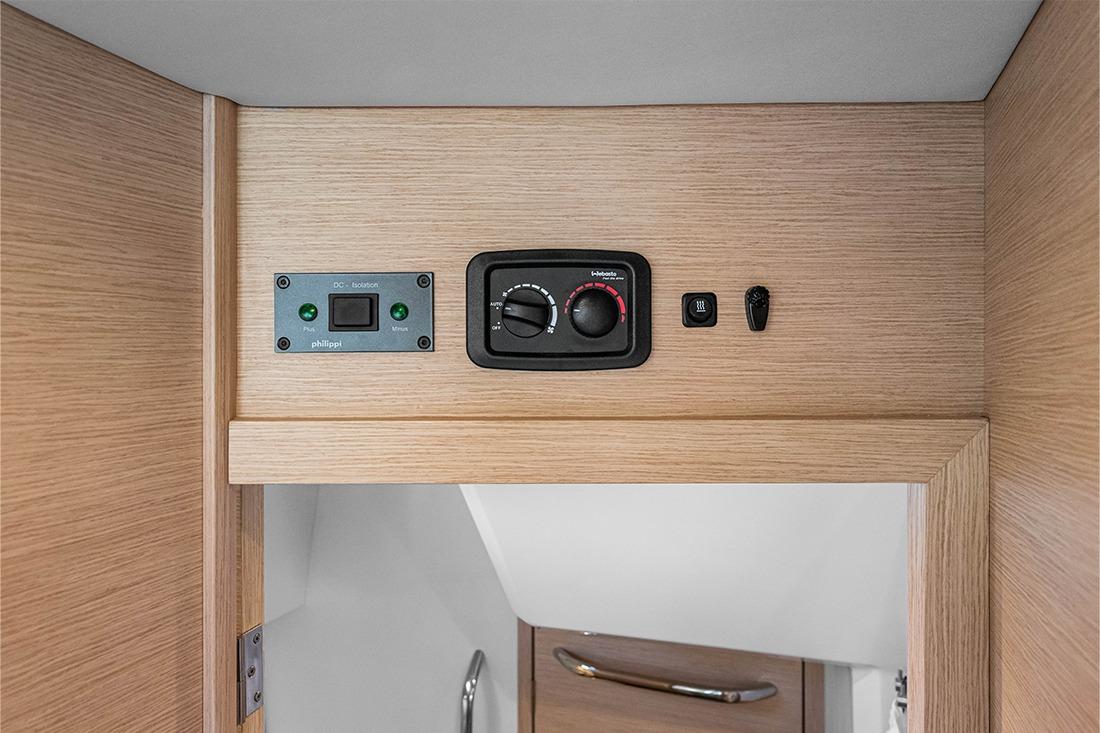Control panel inside 2025 Garcia 45 Explorer yacht, featuring various switches and dials.