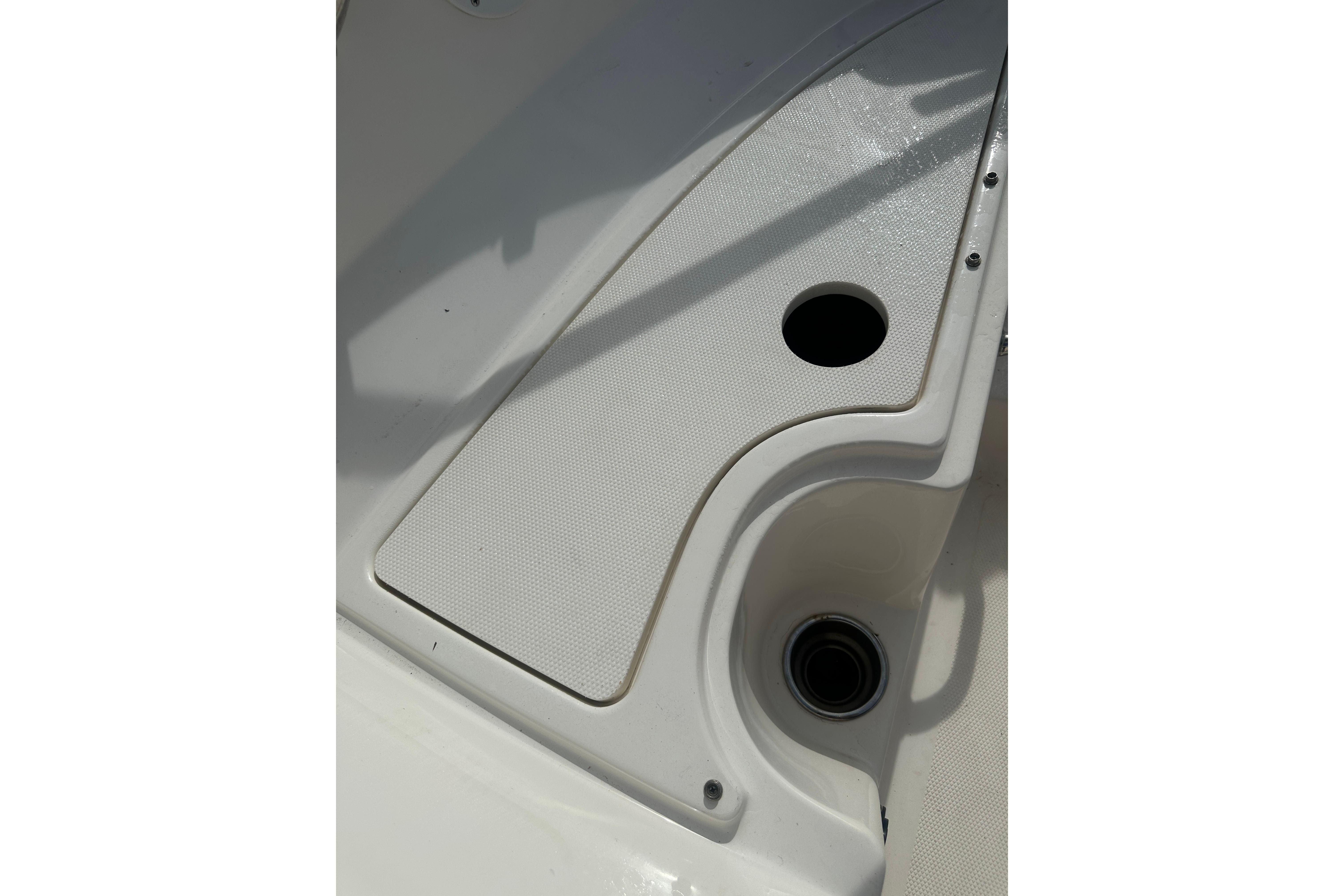 2017 Sea Ray SPX 190 Outboard boat deck with cup holders and textured surface.