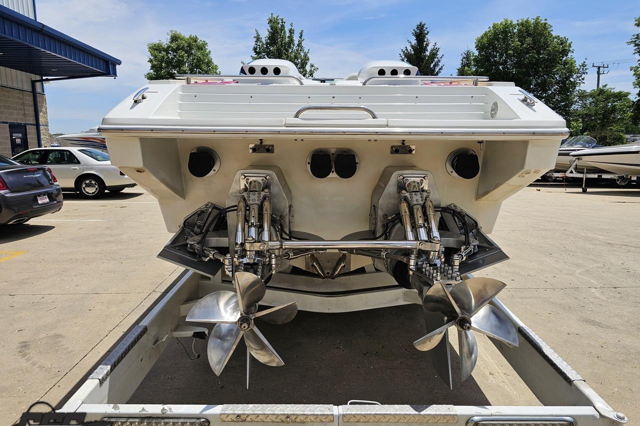 Rear view of a 2002 Formula 382 FASTech boat with dual propellers.