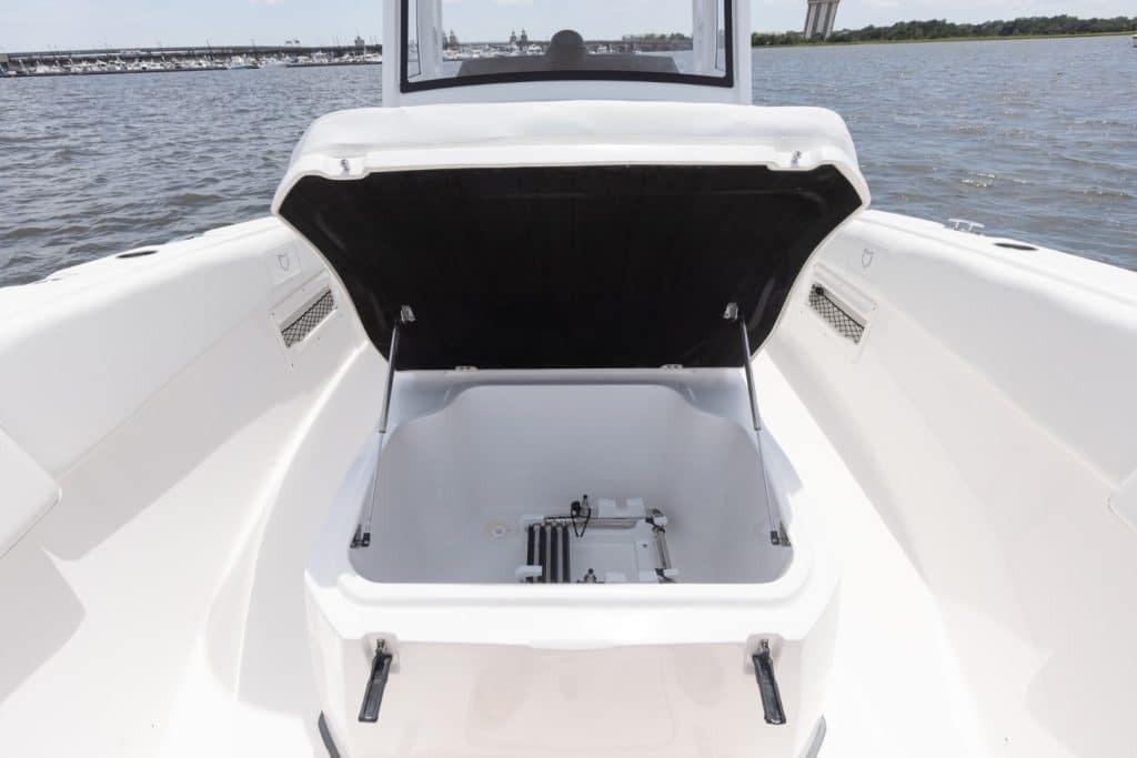 Open storage compartment on 2027 Sea Fox 268 Commander boat, with ocean view in background.