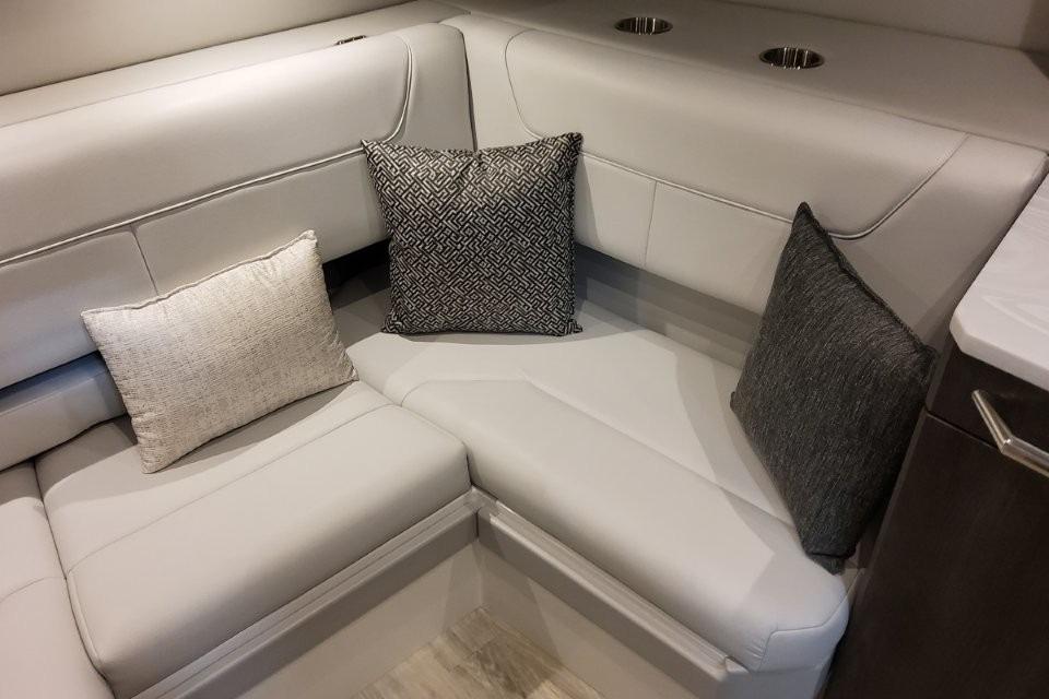 Luxurious seating area in 2026 Formula 380 Super Sport Crossover OB boat interior.