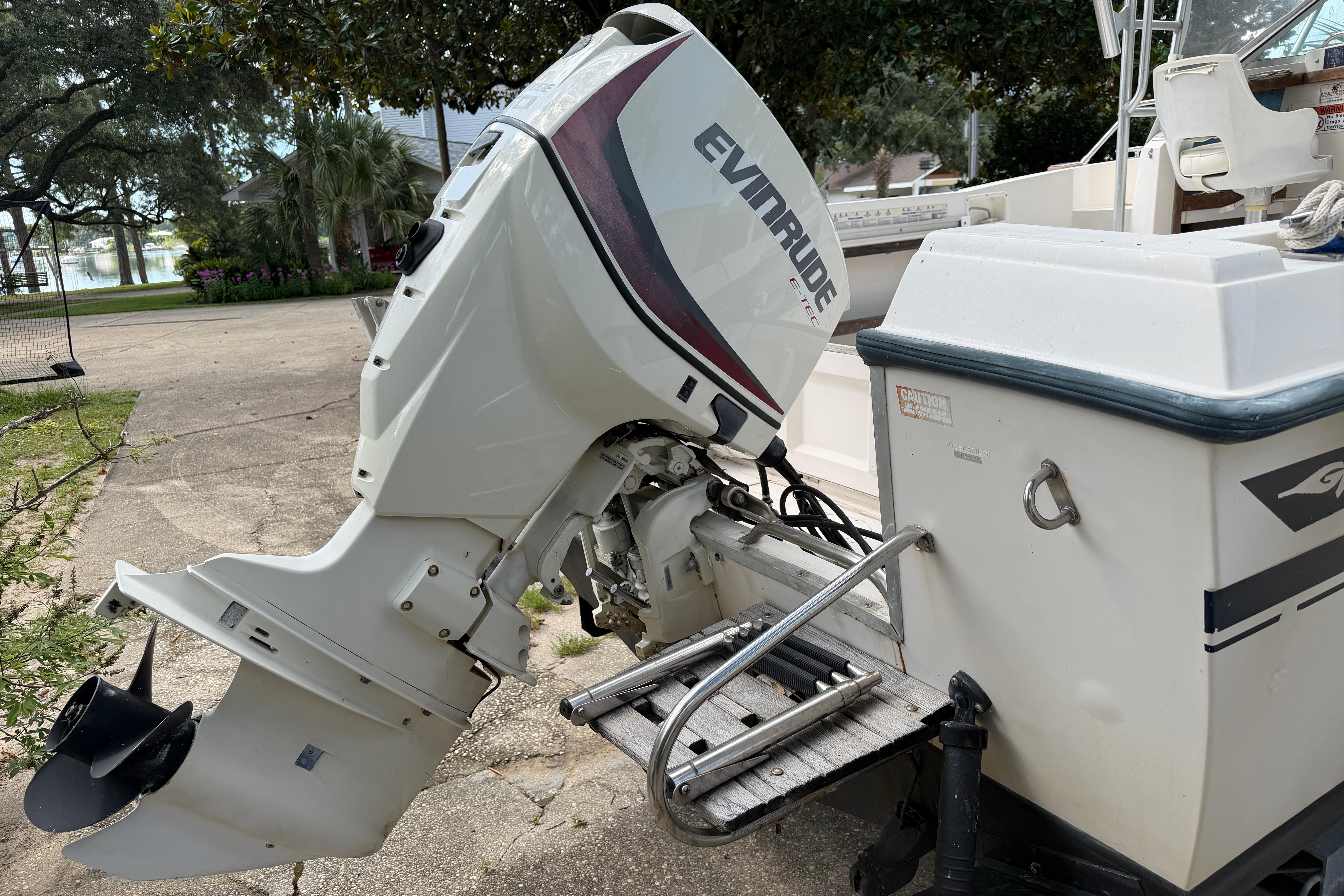 1987 Grady-White Seafarer 226 with Evinrude outboard motor, parked outdoors.