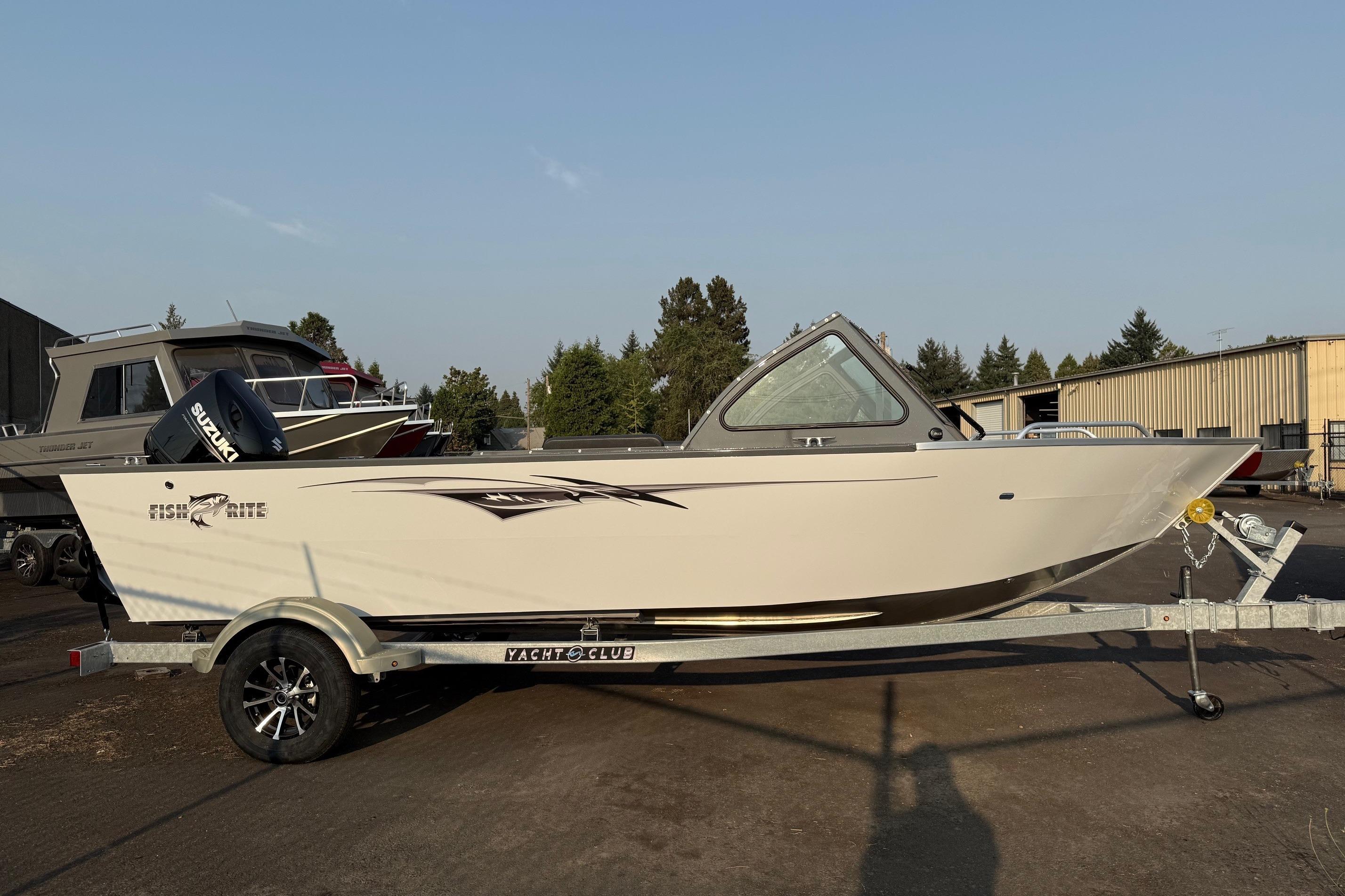 2026 Fish Rite Sportsman 20 boat on trailer, parked outdoors.