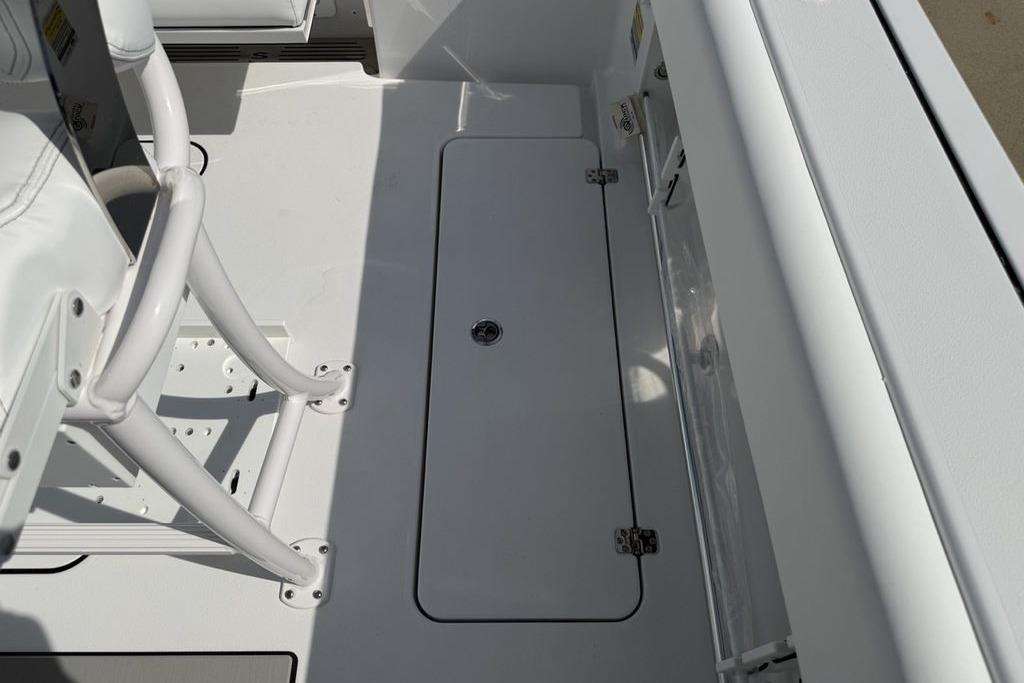 2026 Sportsman Open 252 Center Console boat interior with storage compartment.