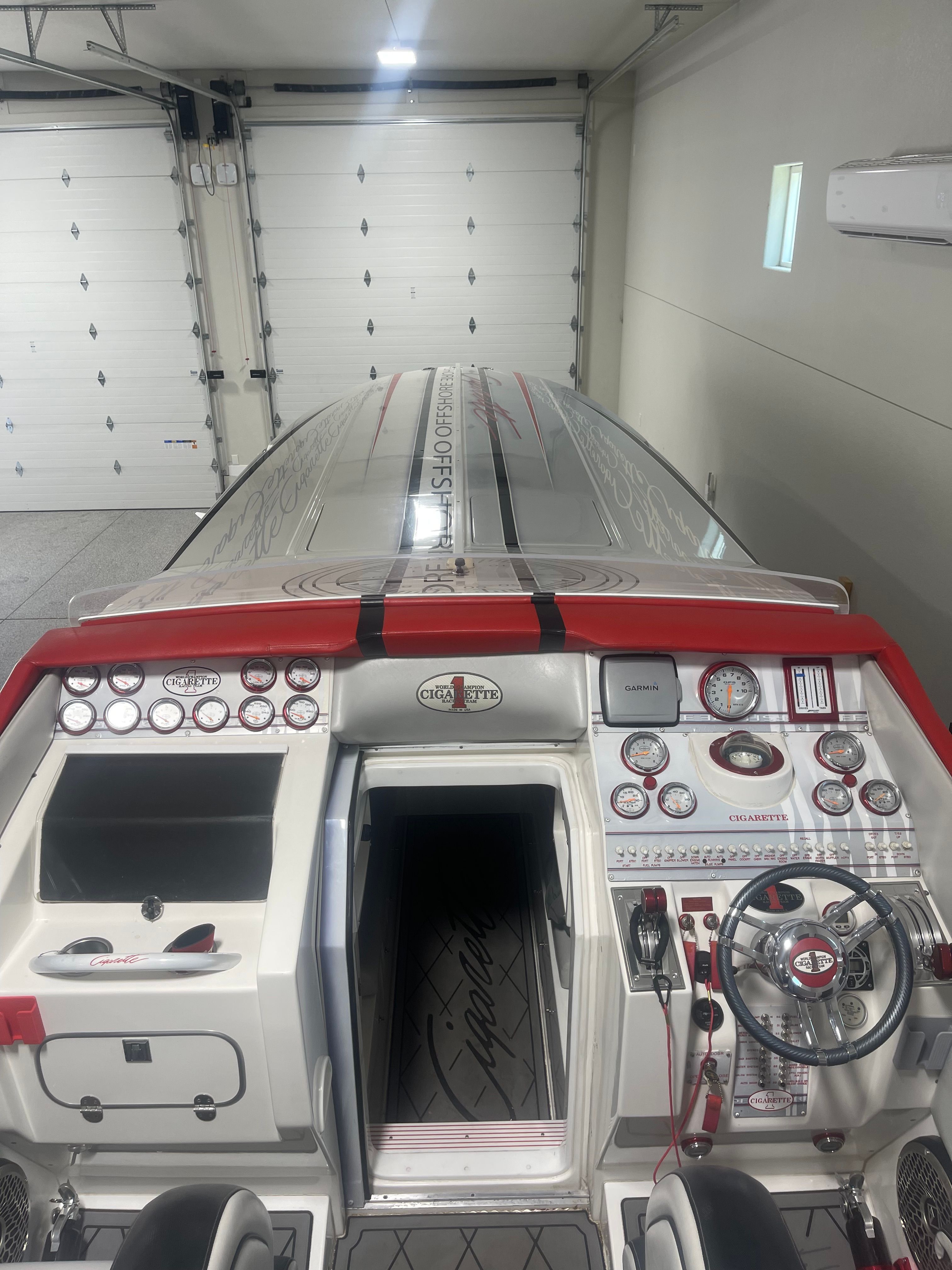 2004 Cigarette 38' Top Gun cockpit with controls and instruments.